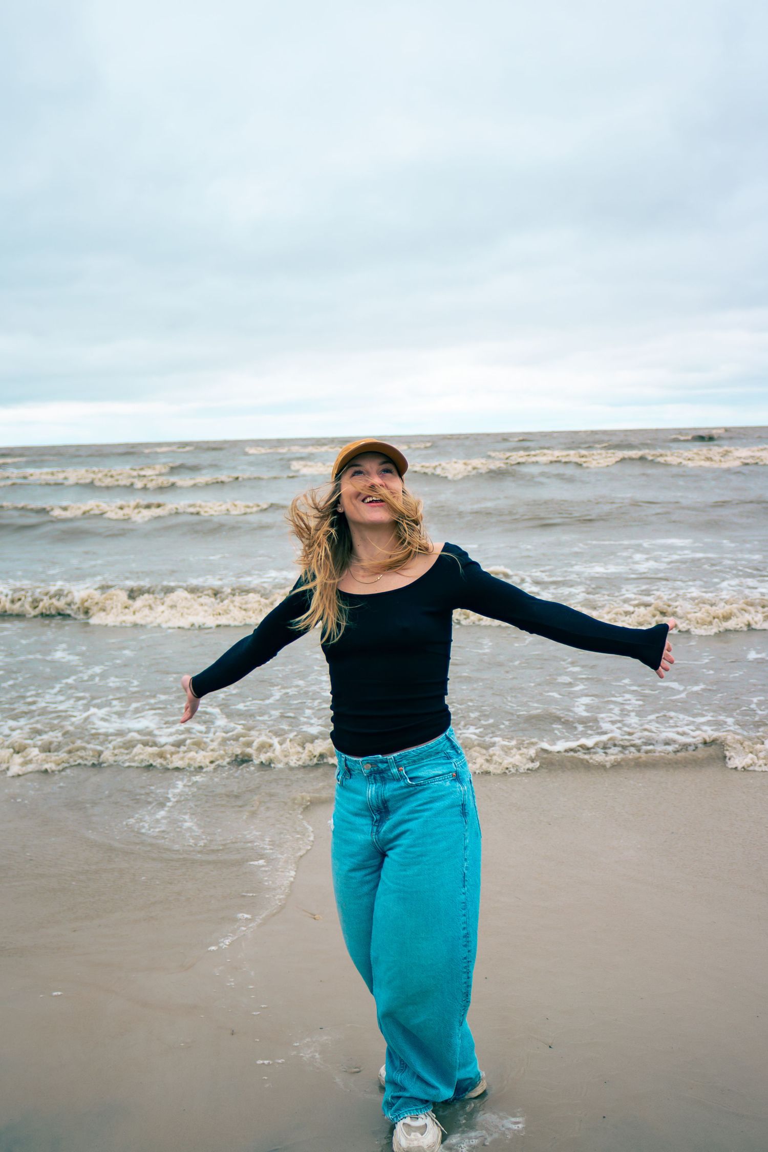 young woman posing at the beach