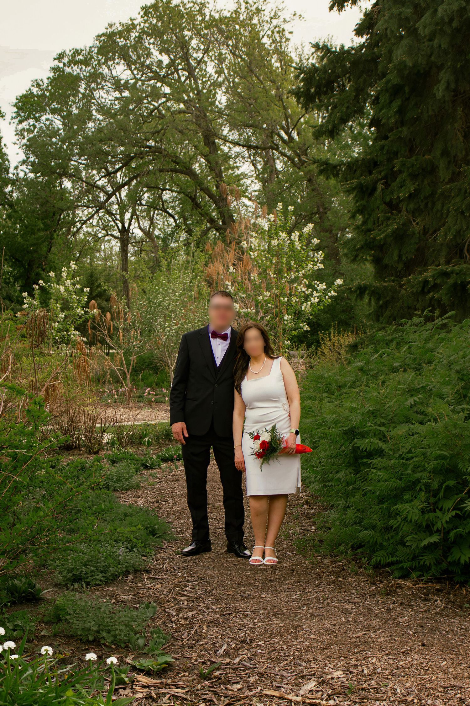couple posing in a garden