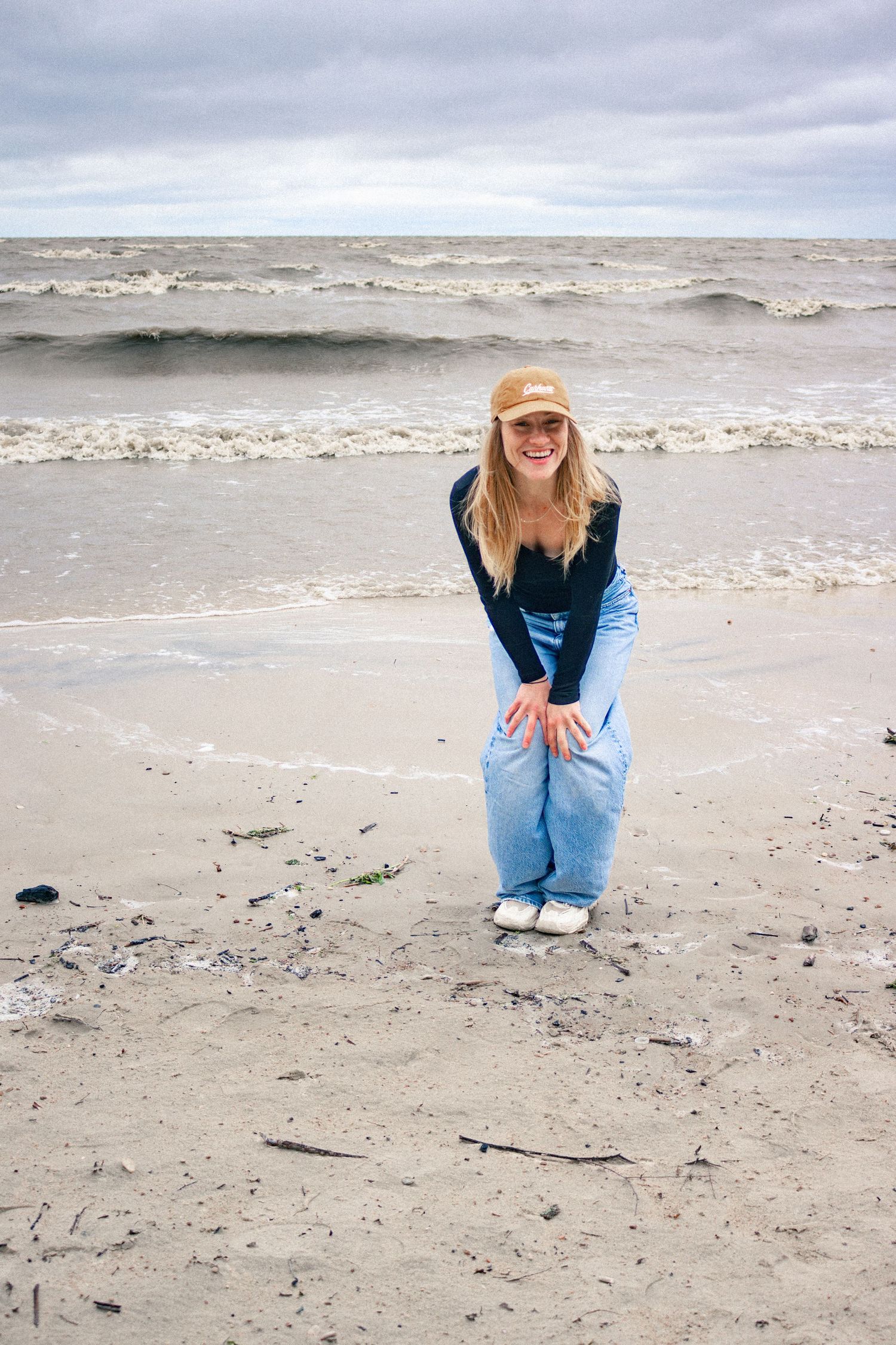 young woman posing at the beach