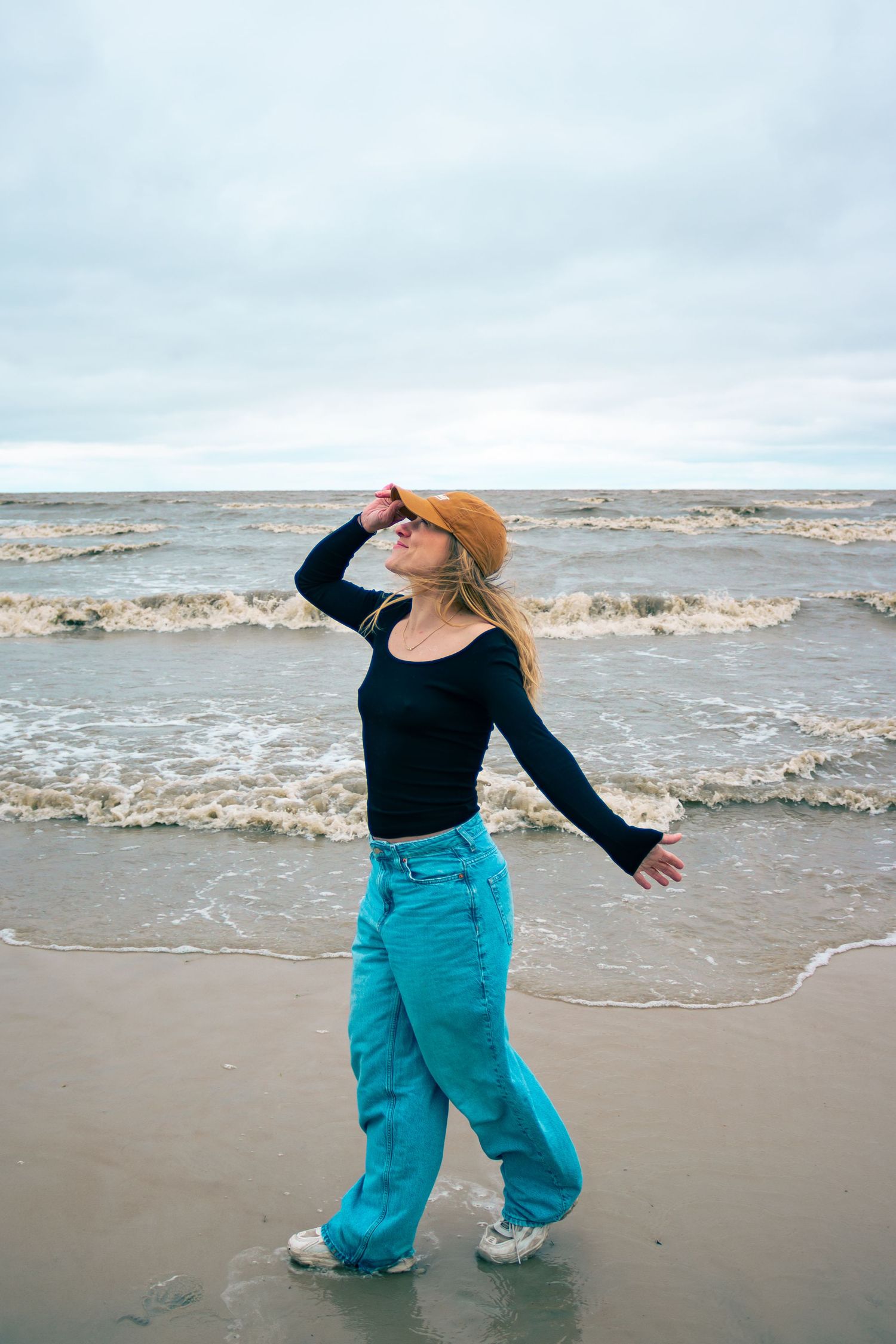 young woman posing at the beach