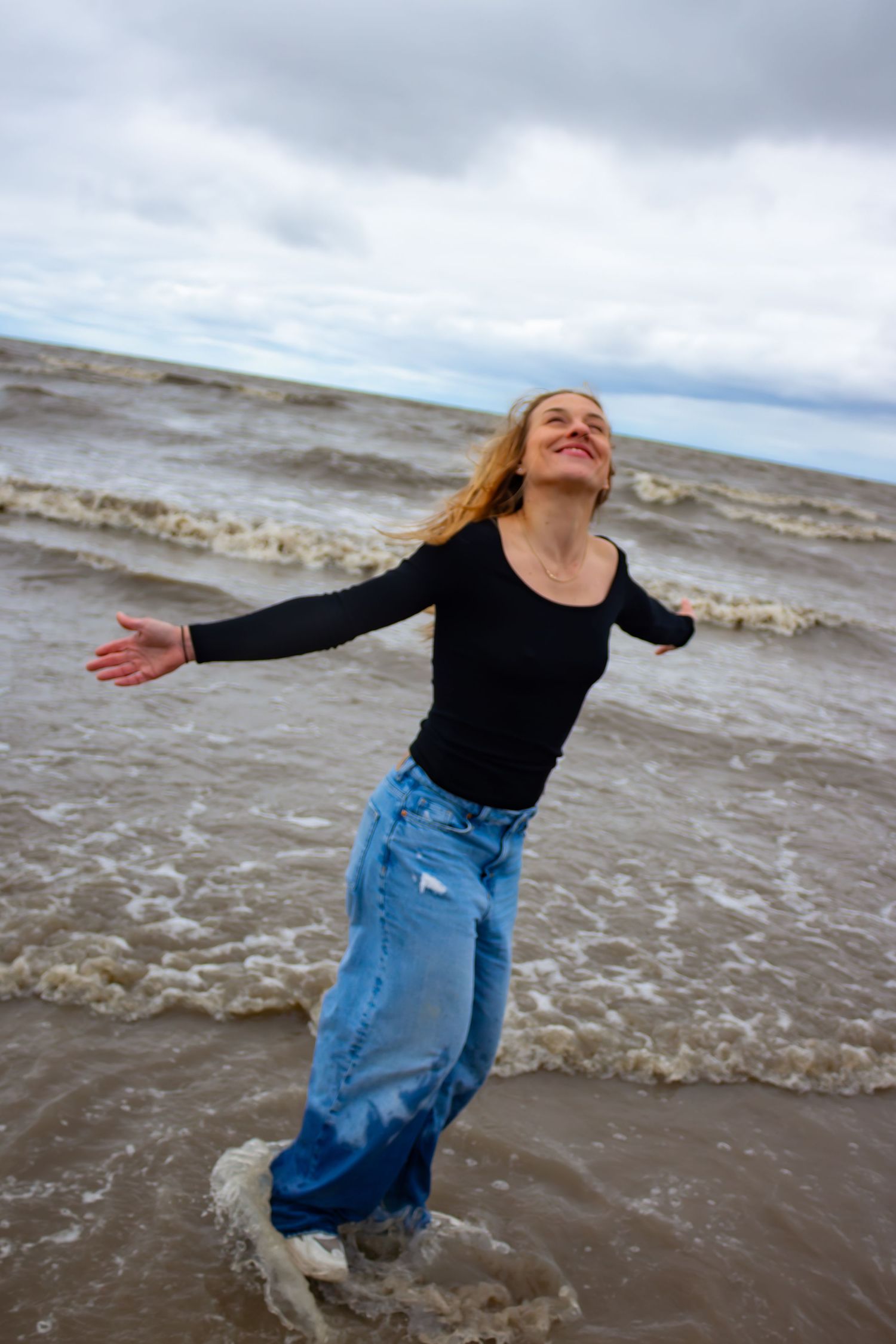 young woman posing at the beach