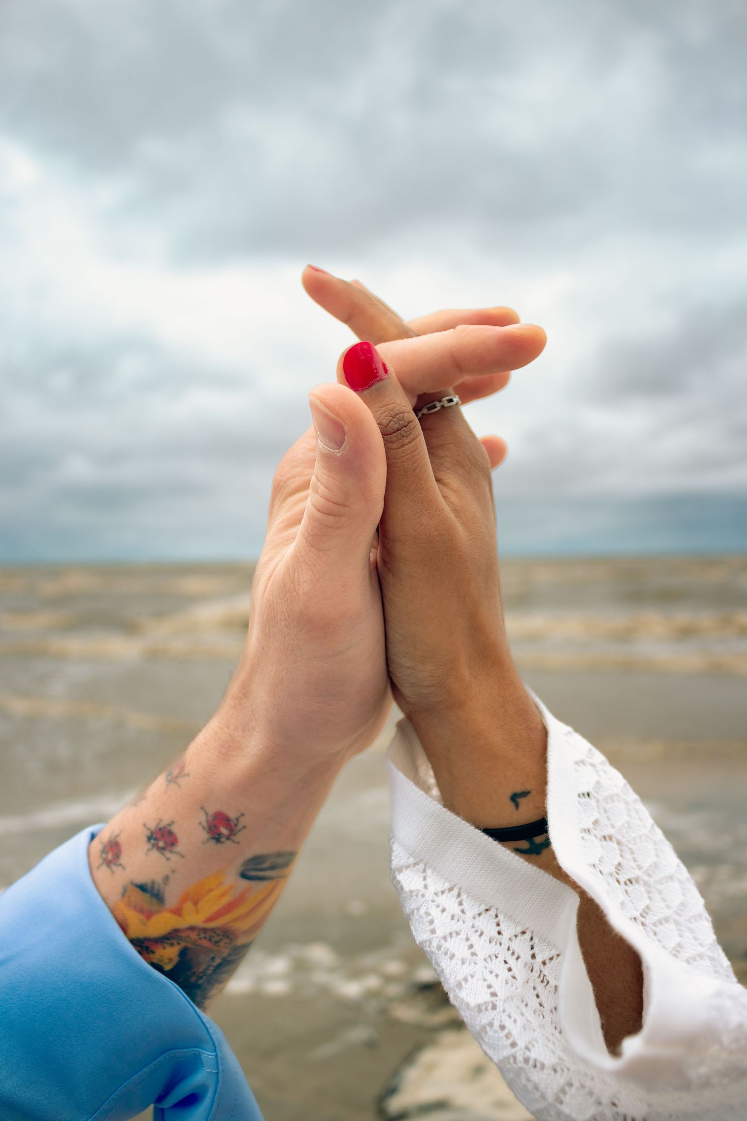 young couple posing at the beach