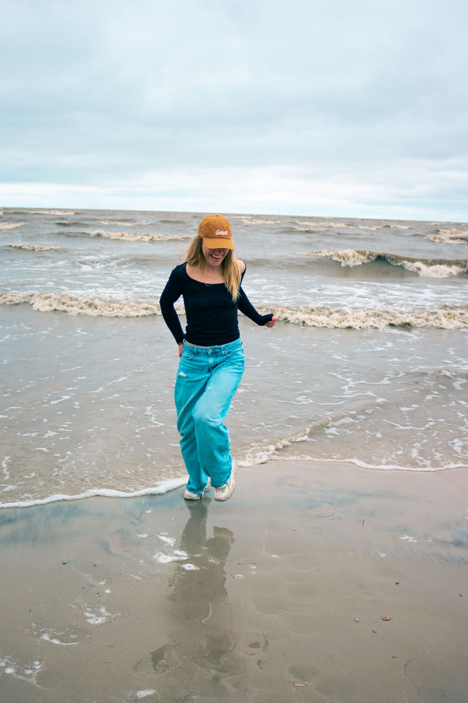 young woman posing at the beach