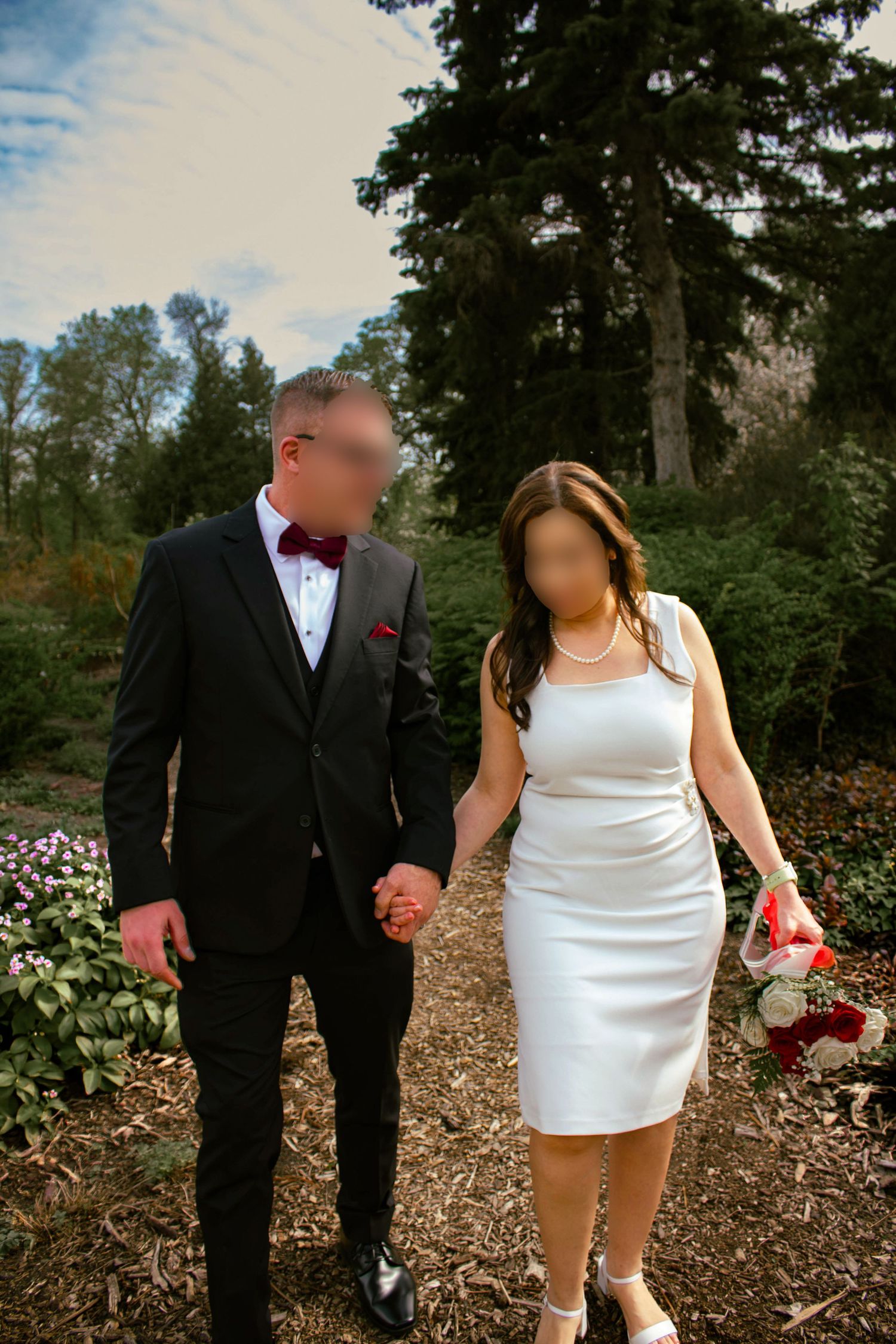 couple posing in a garden