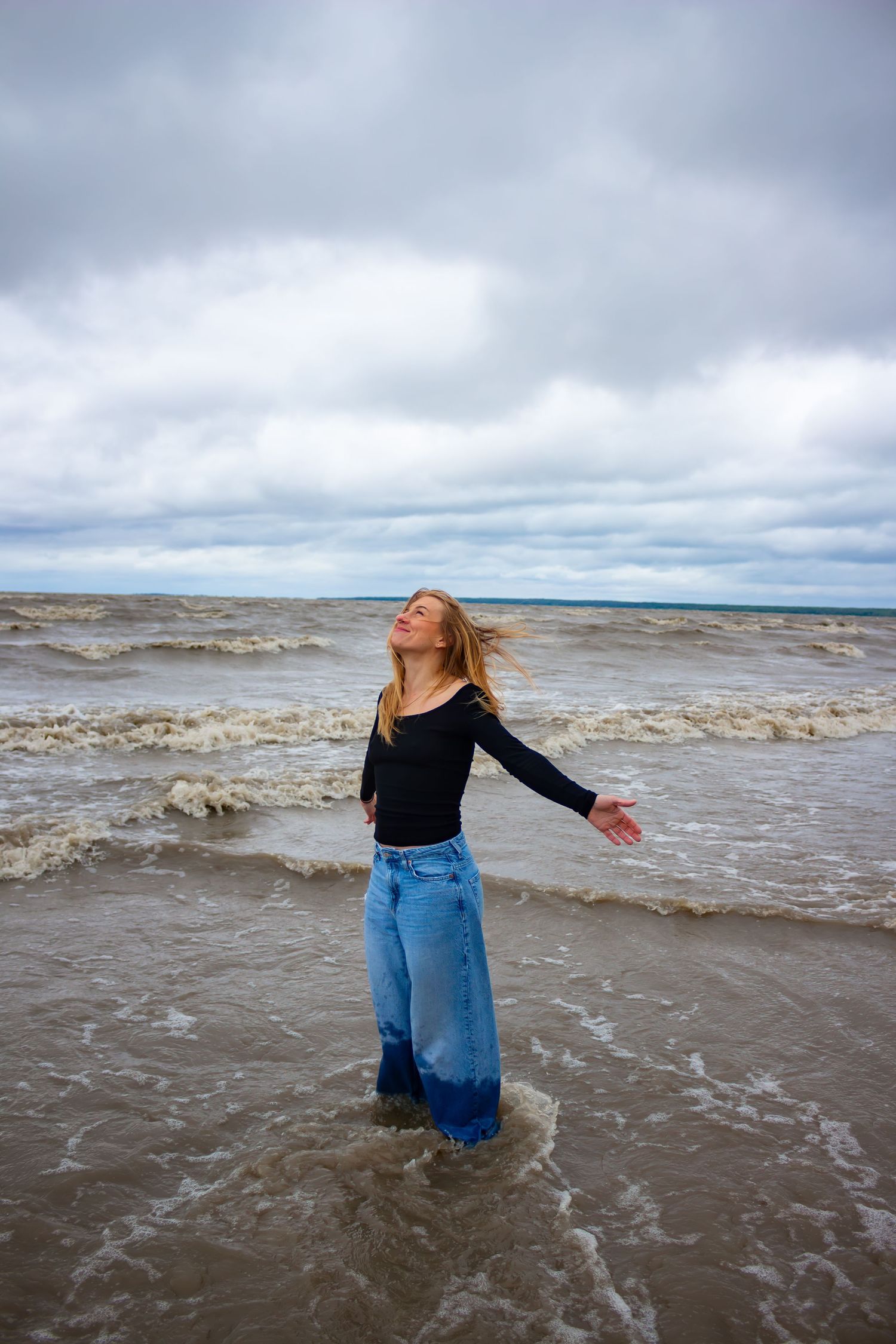 young woman posing at the beach