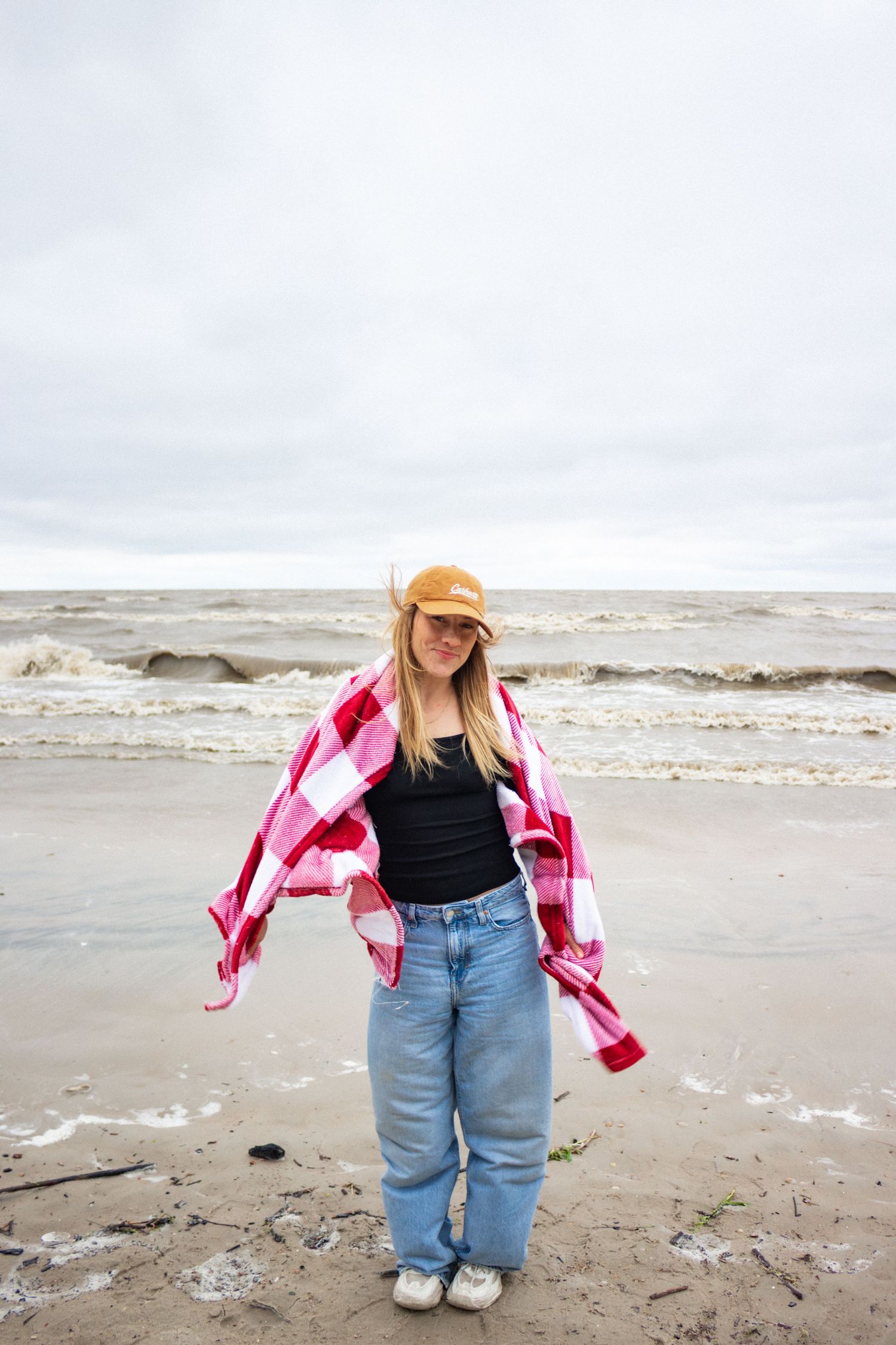 young woman posing at the beach