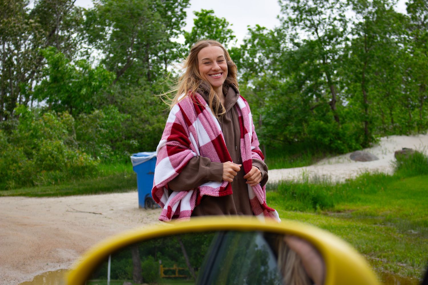 young woman posing in a parking lot
