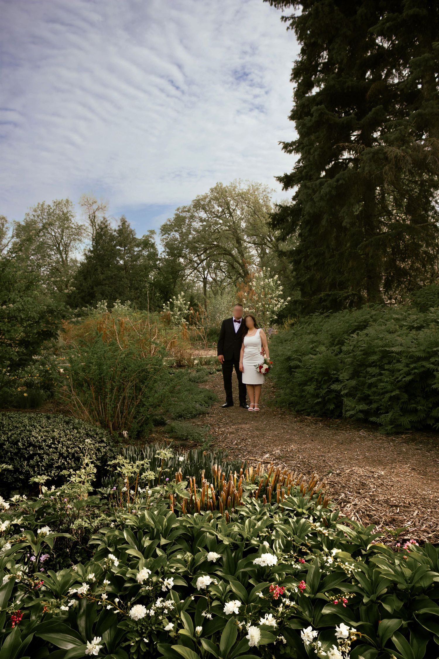 couple posing in a garden