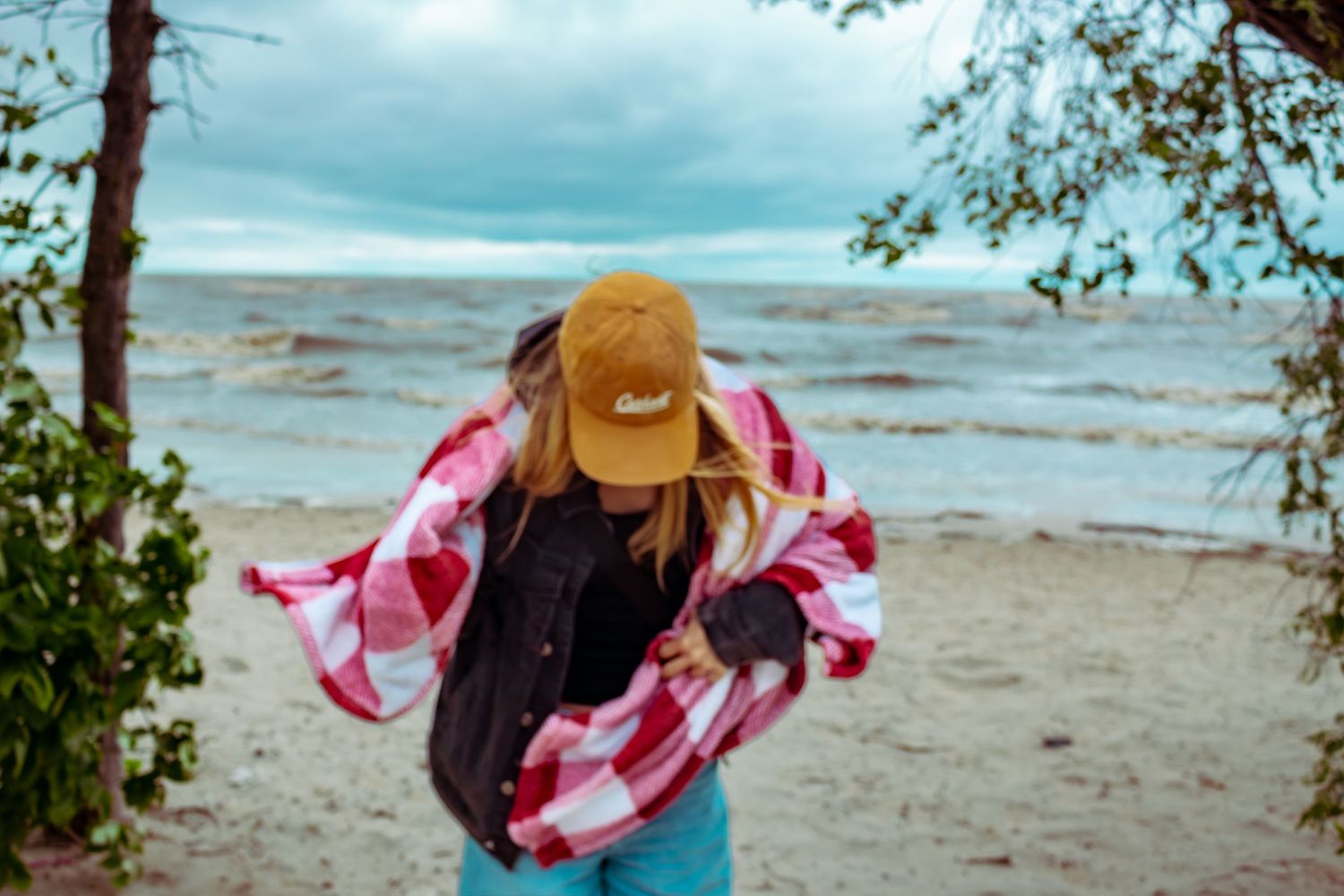 young woman posing at the beach