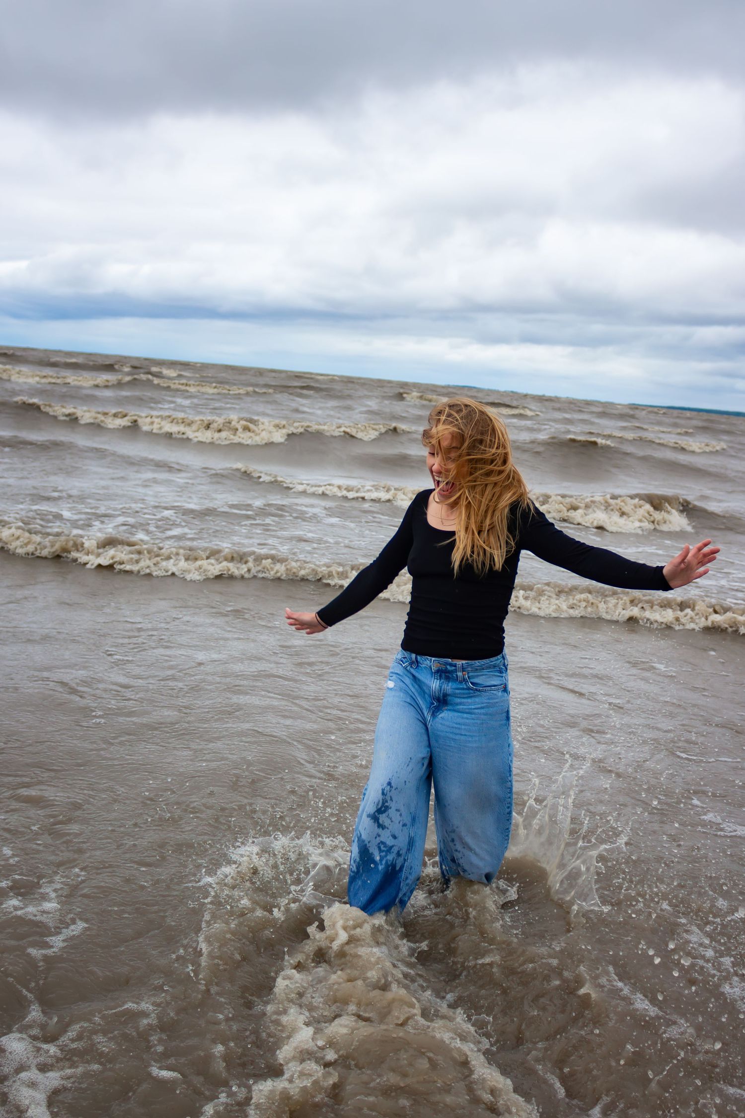 young woman posing at the beach