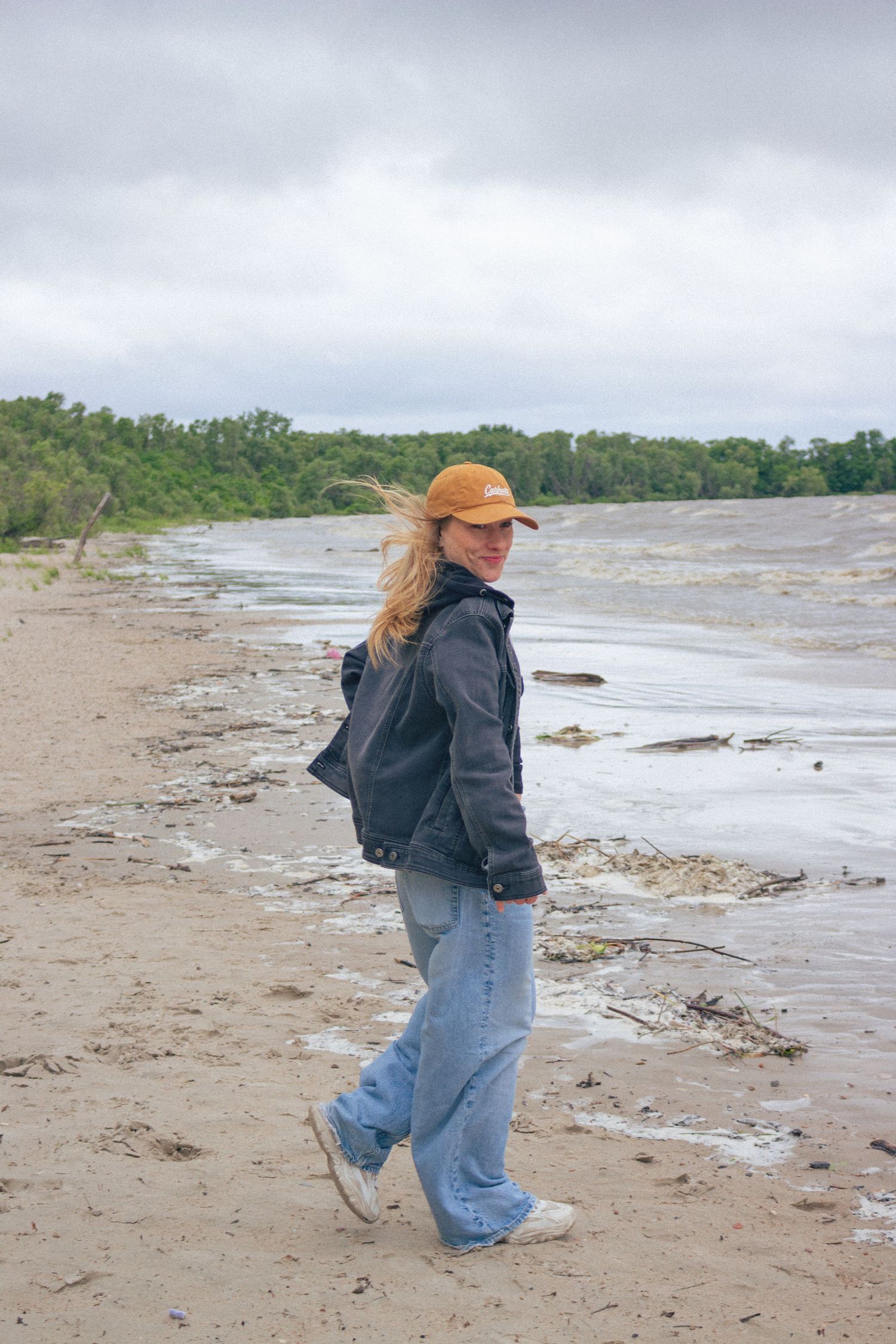 young woman posing at the beach