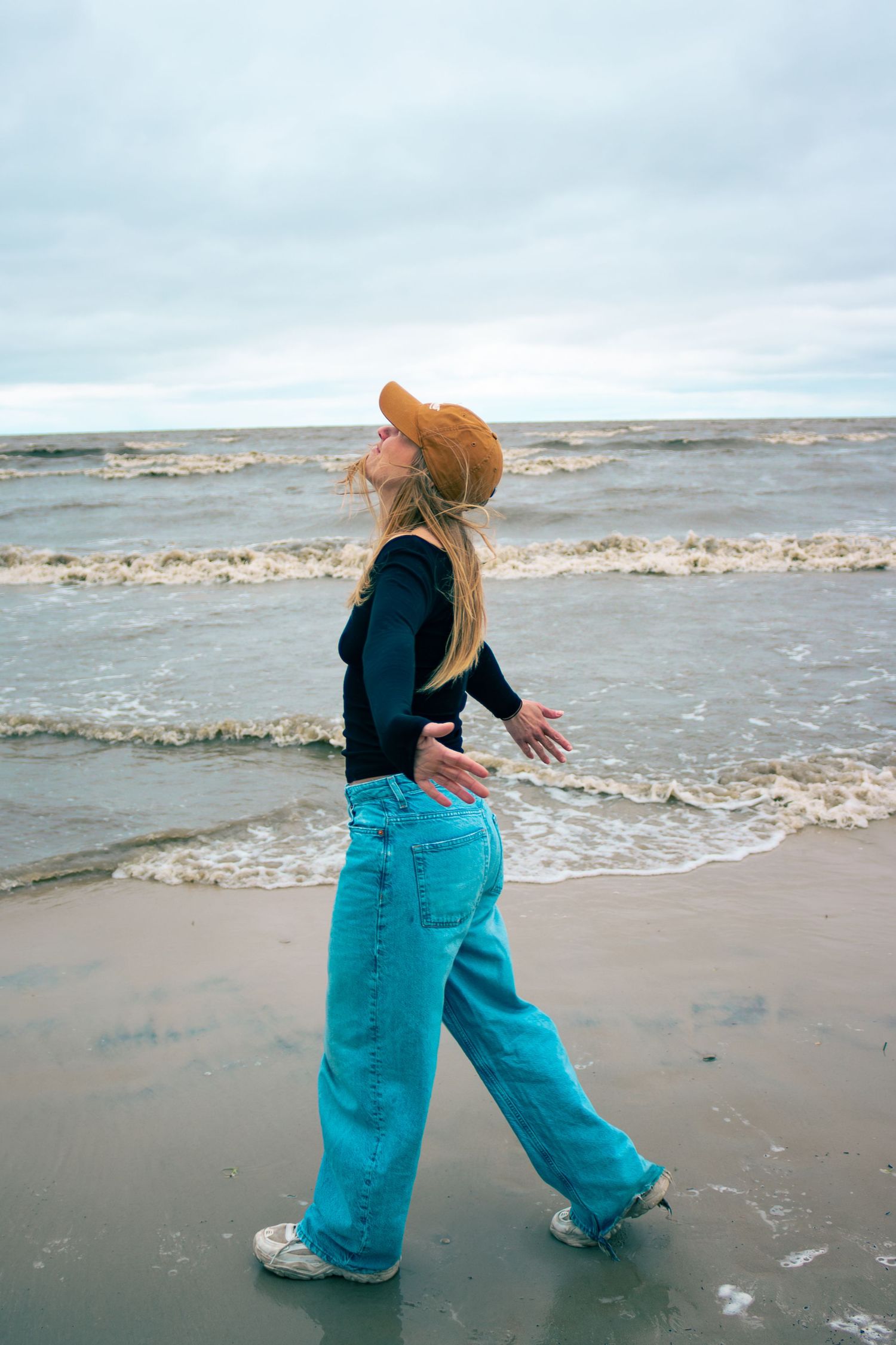 young woman posing at the beach