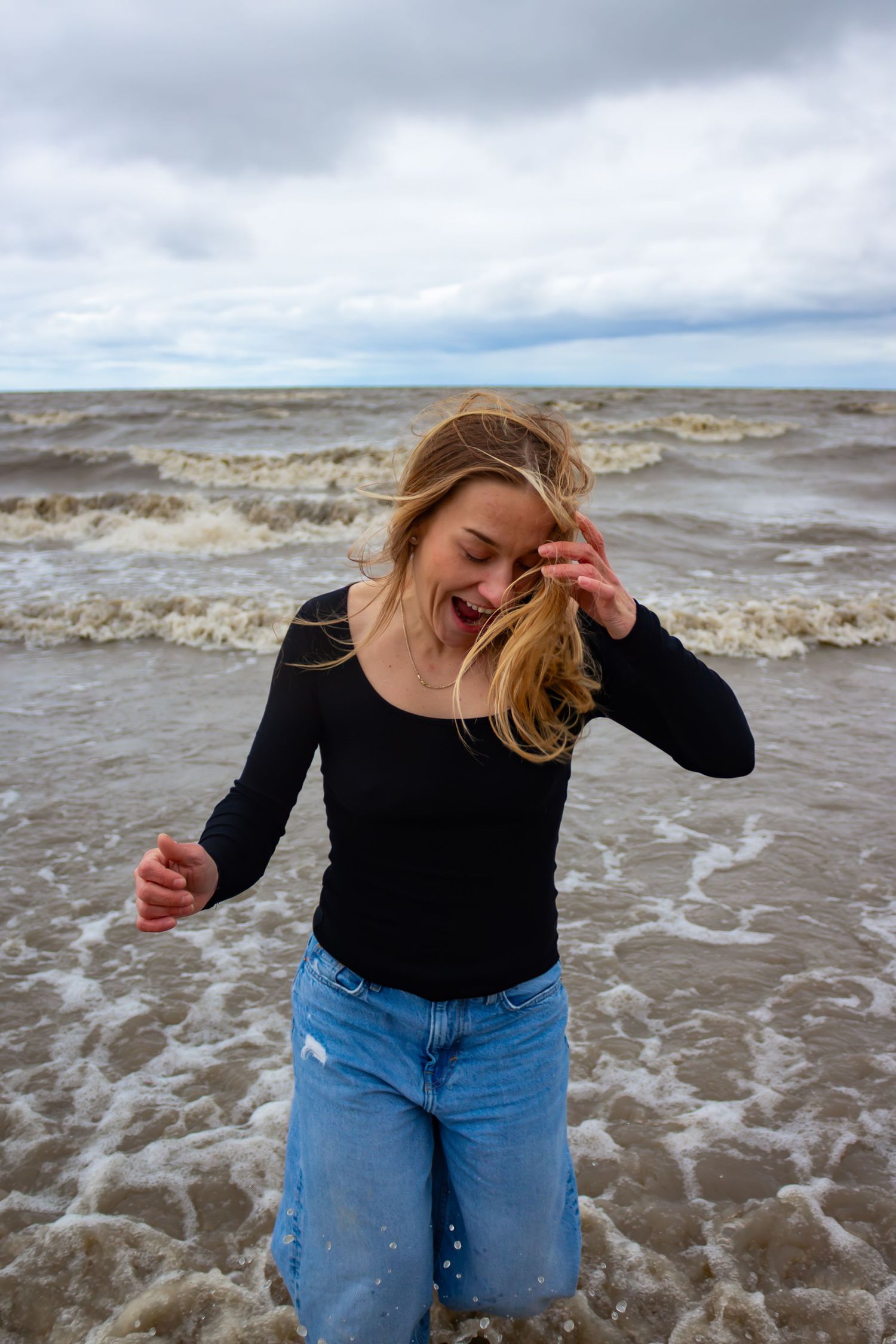young woman posing at the beach