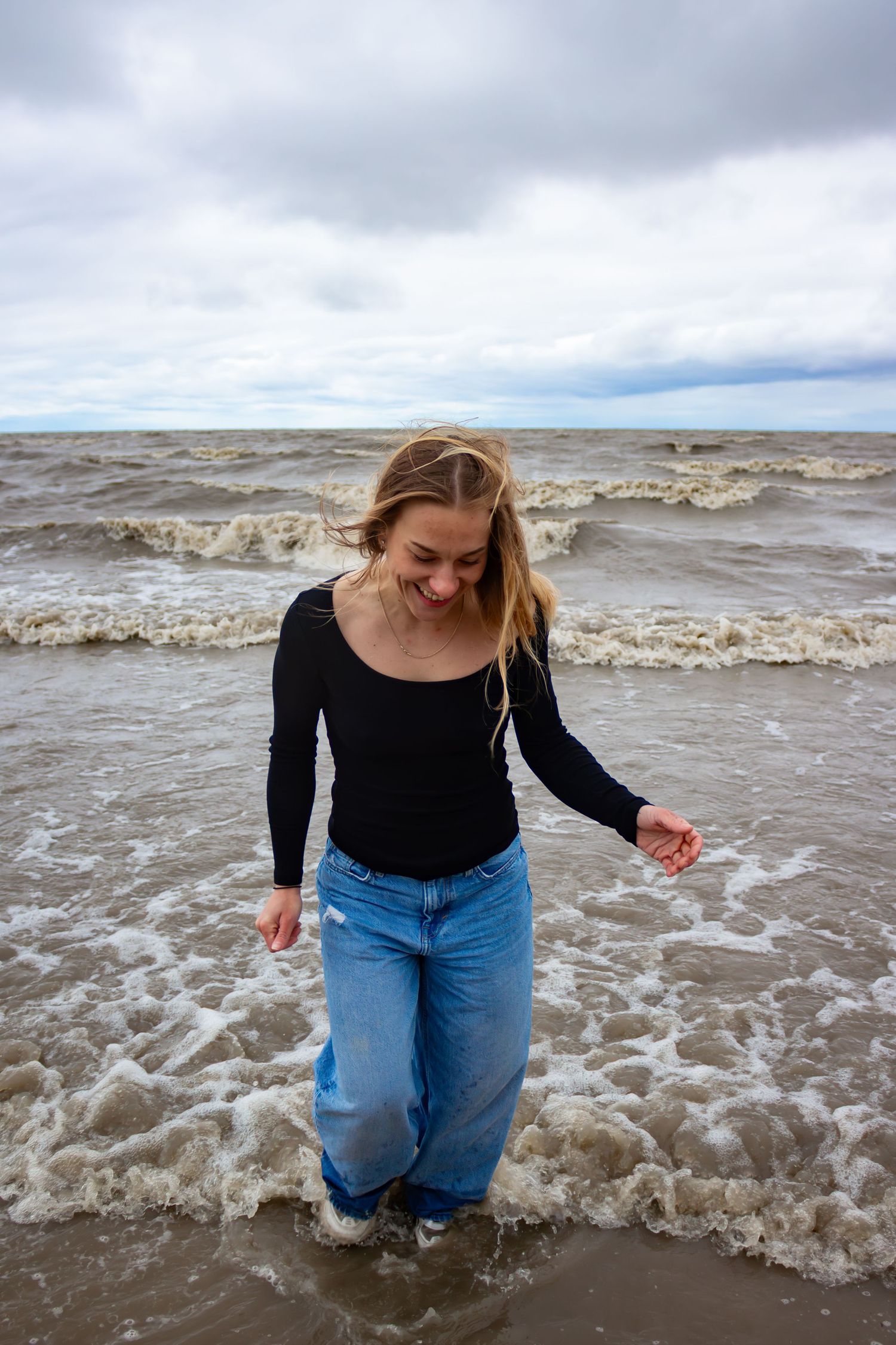 young woman posing at the beach