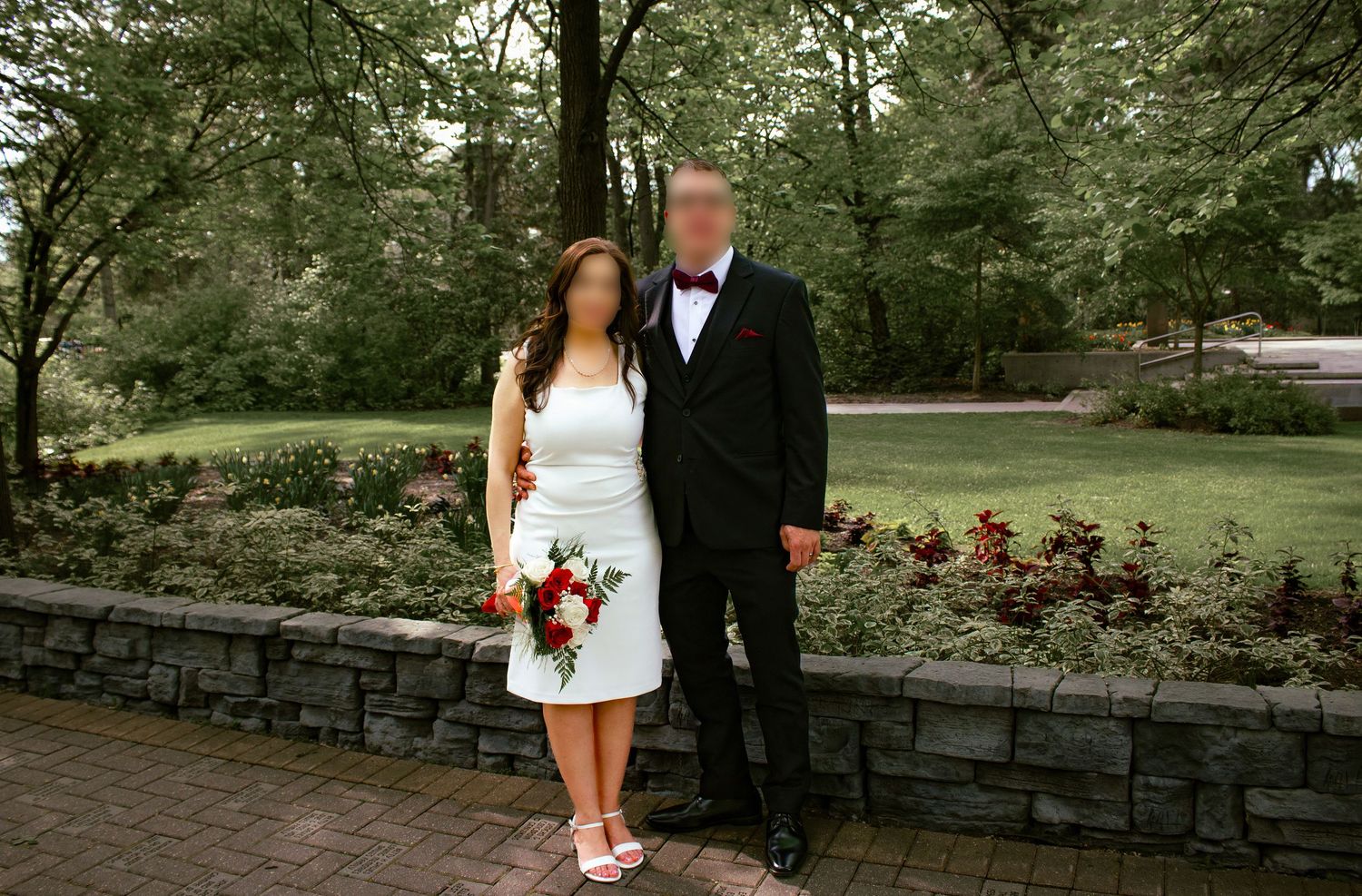 couple posing in a garden