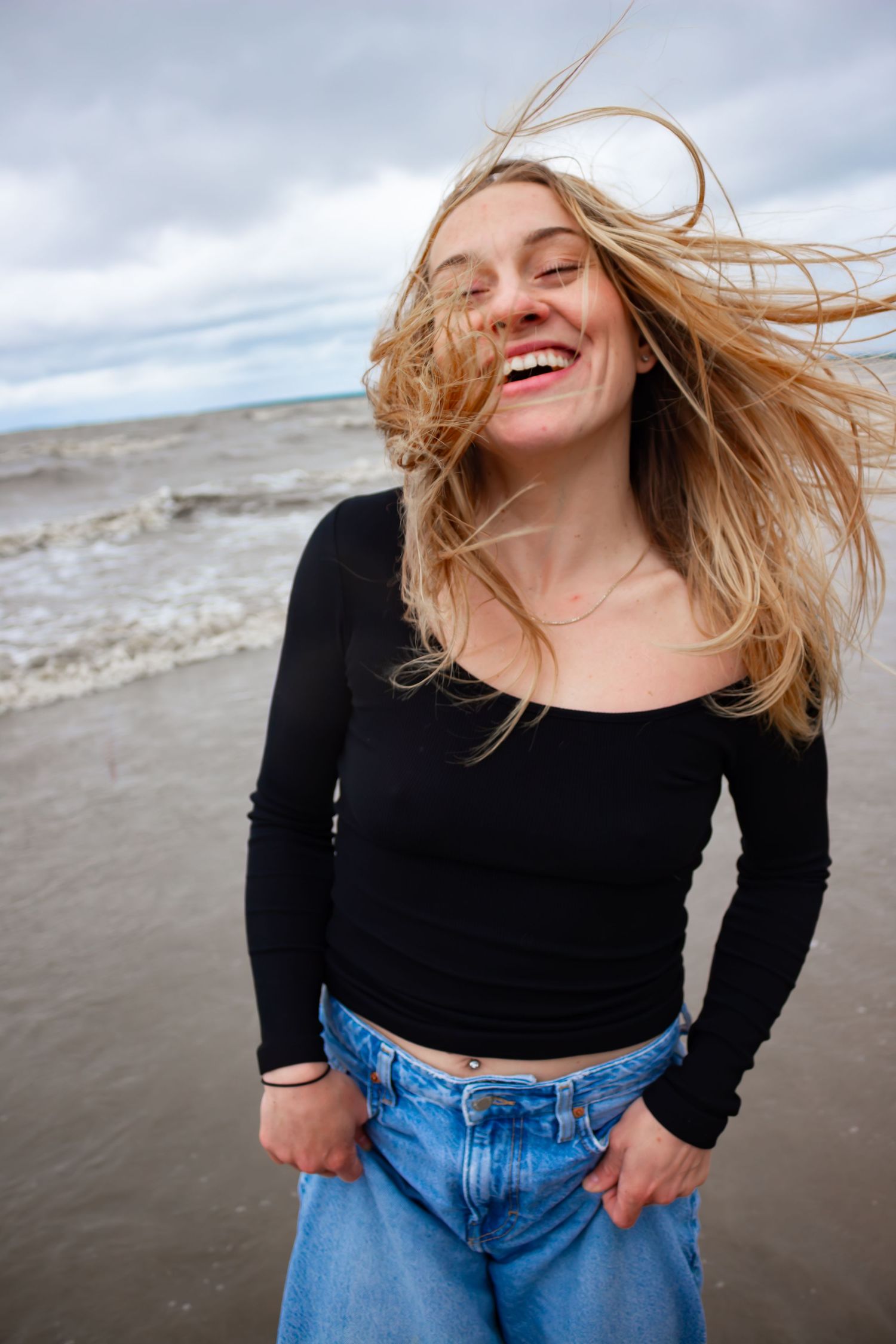 young woman posing at the beach