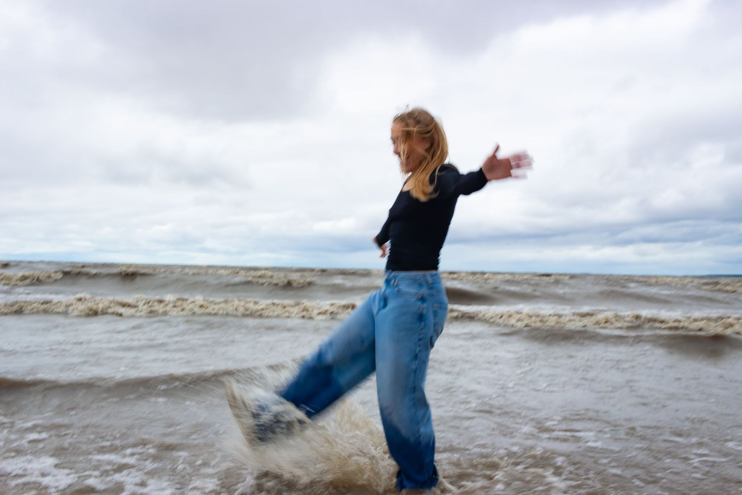 young woman posing at the beach