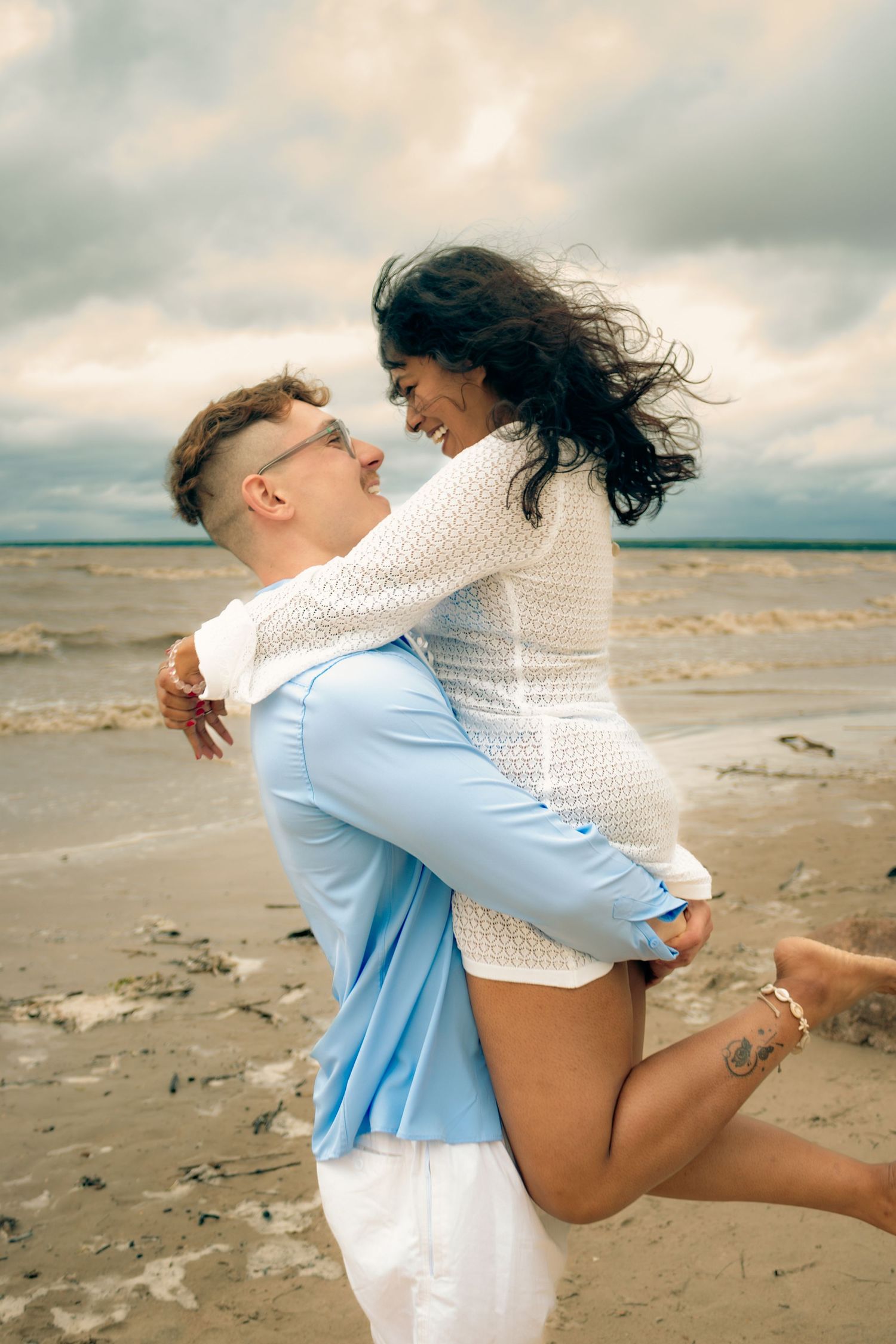 Couple posing at the beach
