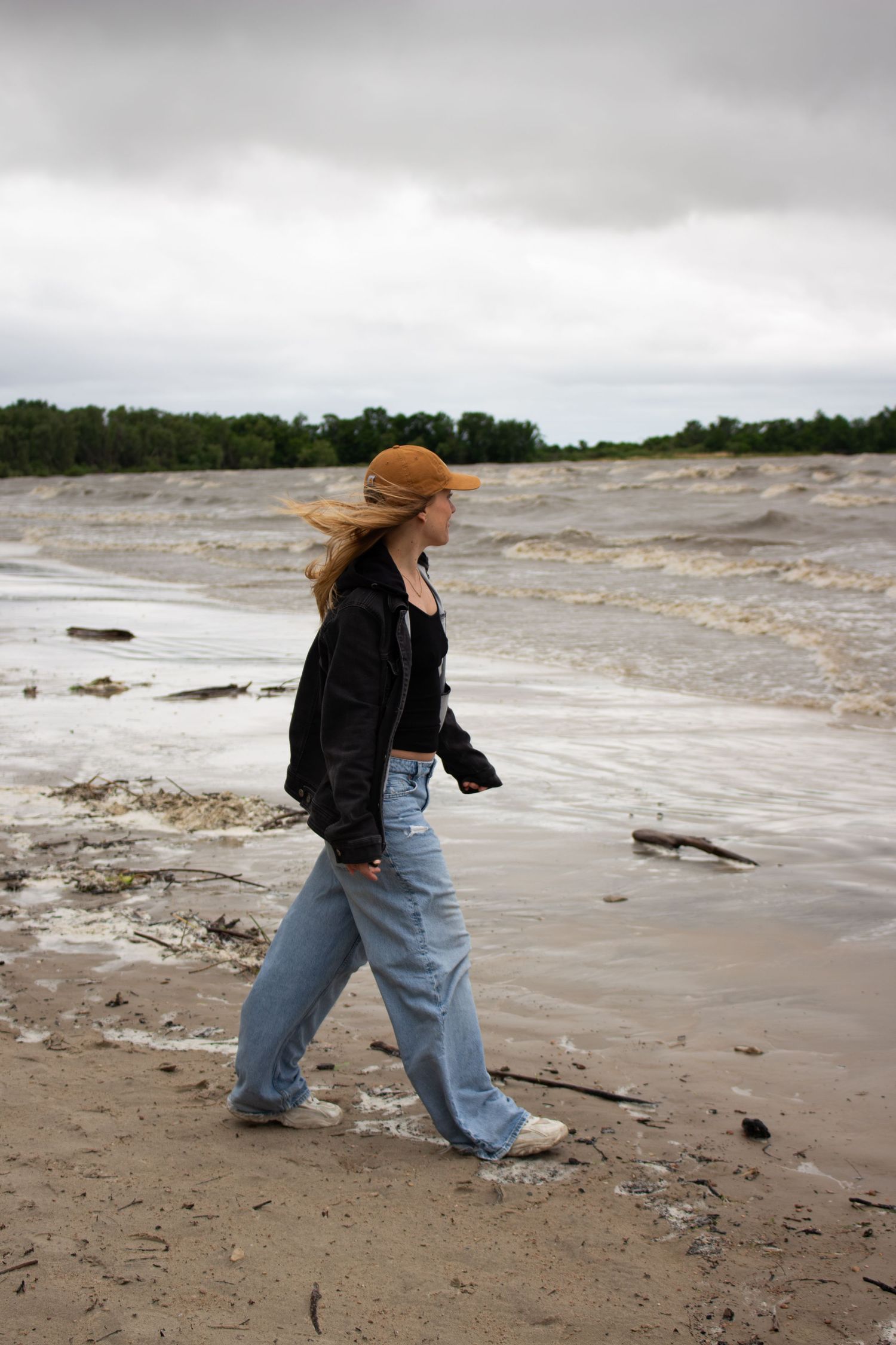 young woman walking on the beach