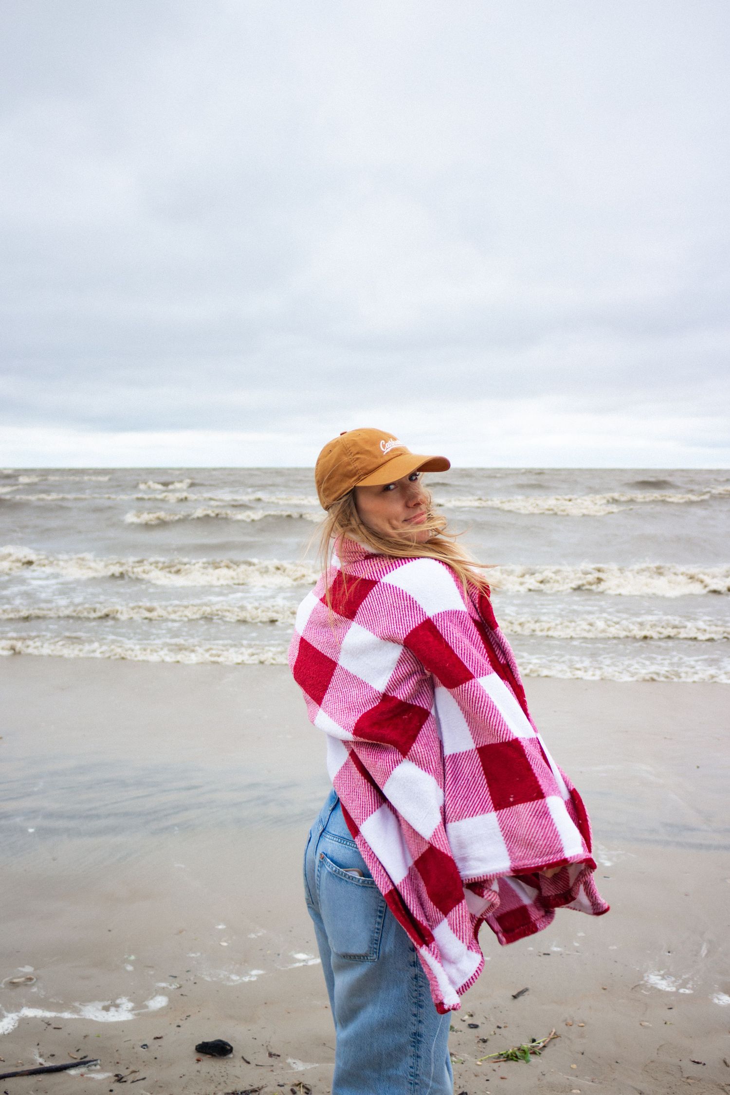 young woman posing at the beach