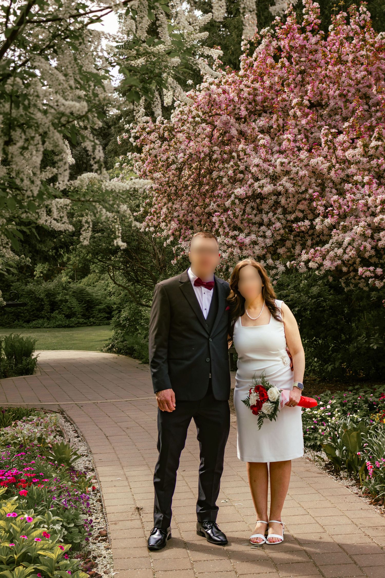 couple posing in a garden