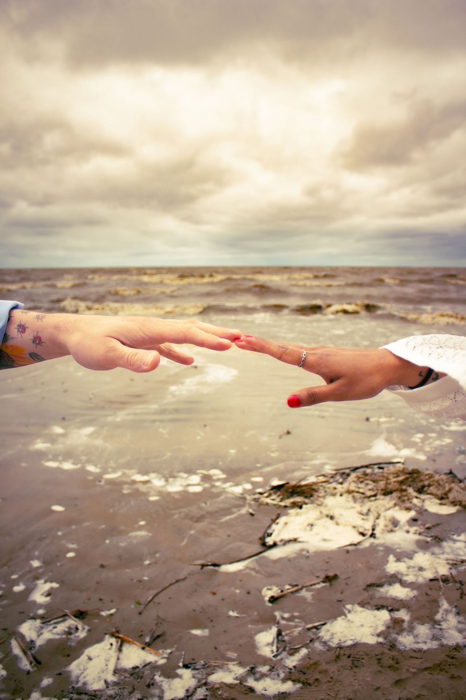 young couple posing at the beach