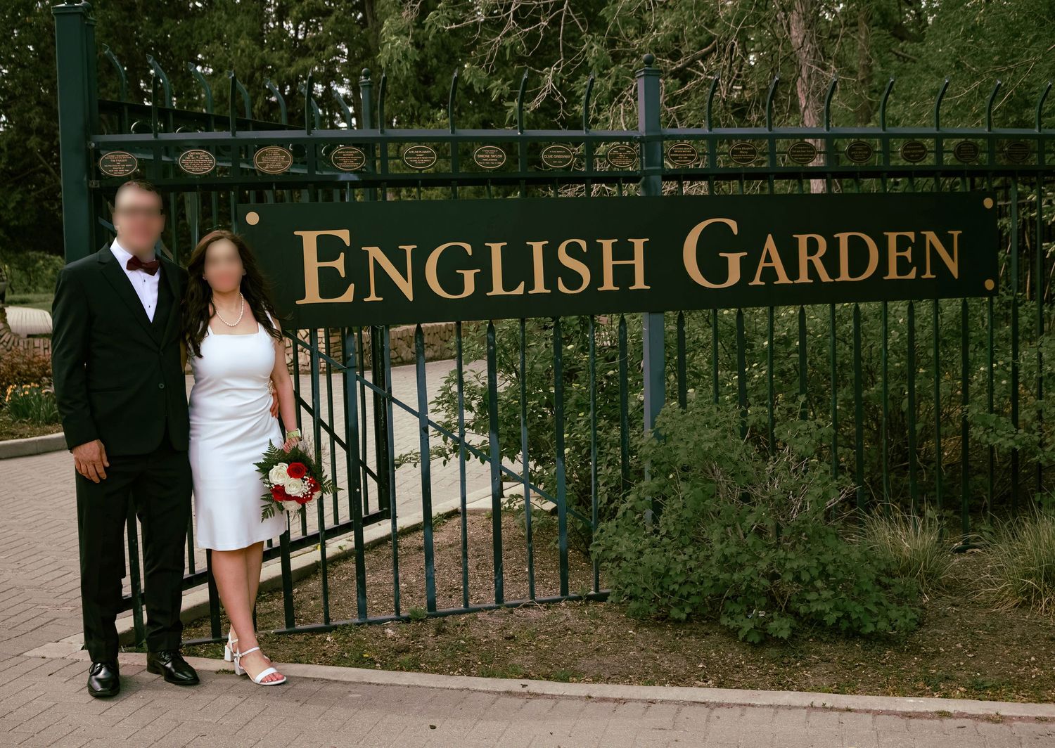 couple posing in a garden
