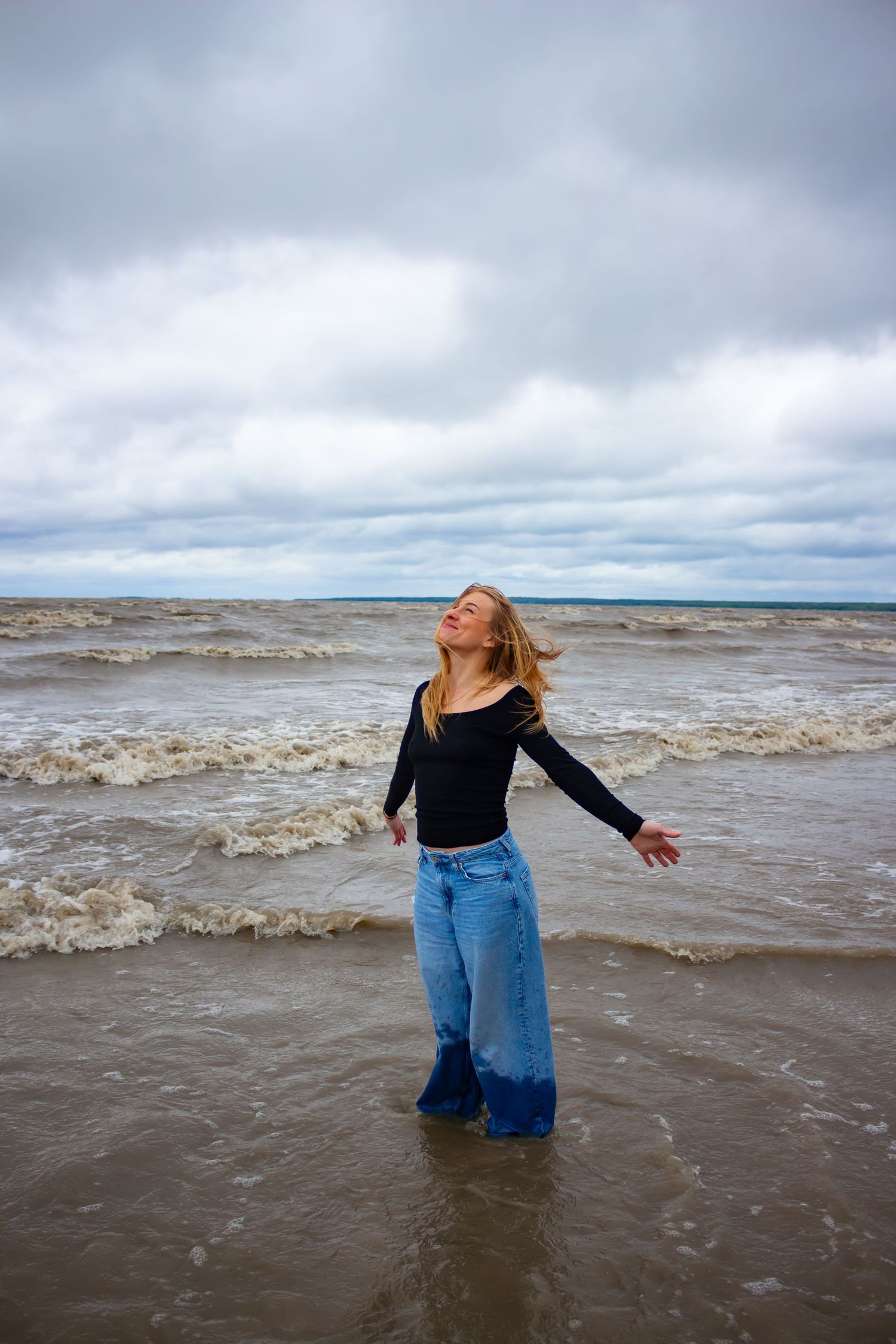 young woman posing at the beach