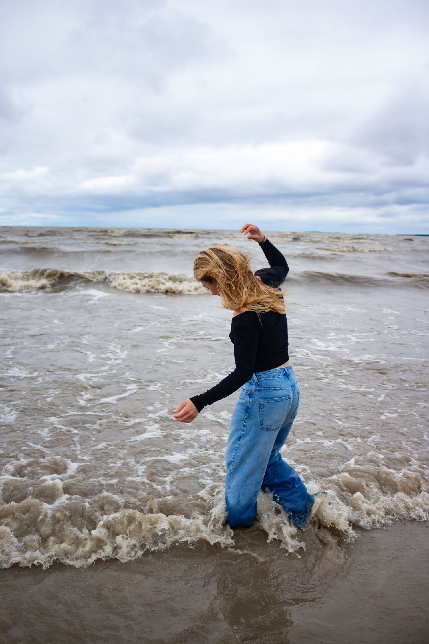 young woman posing at the beach