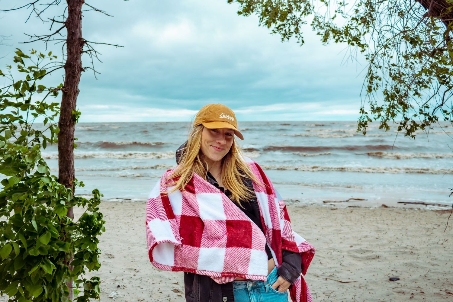 young woman posing at the beach