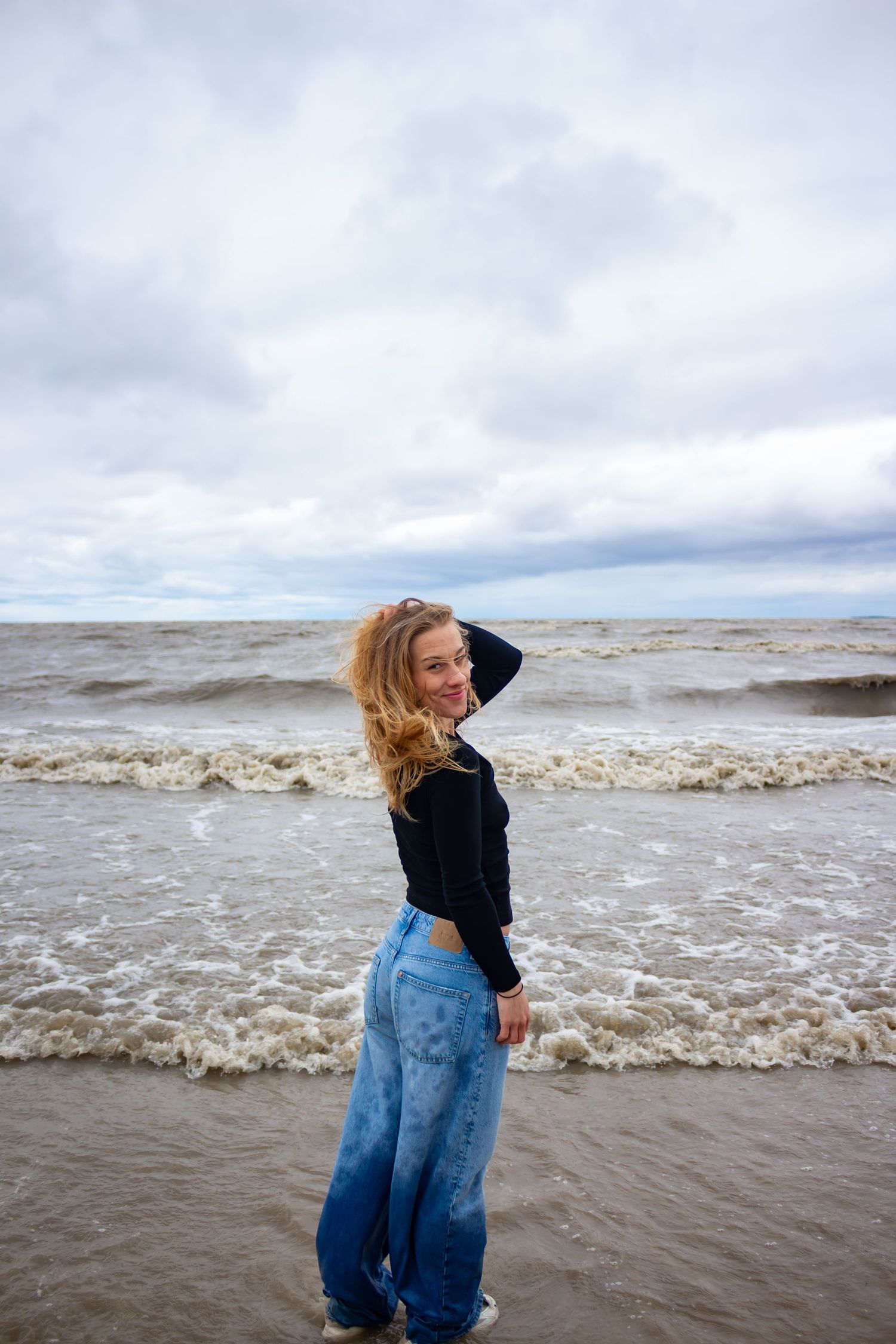 Young woman posing at the beach