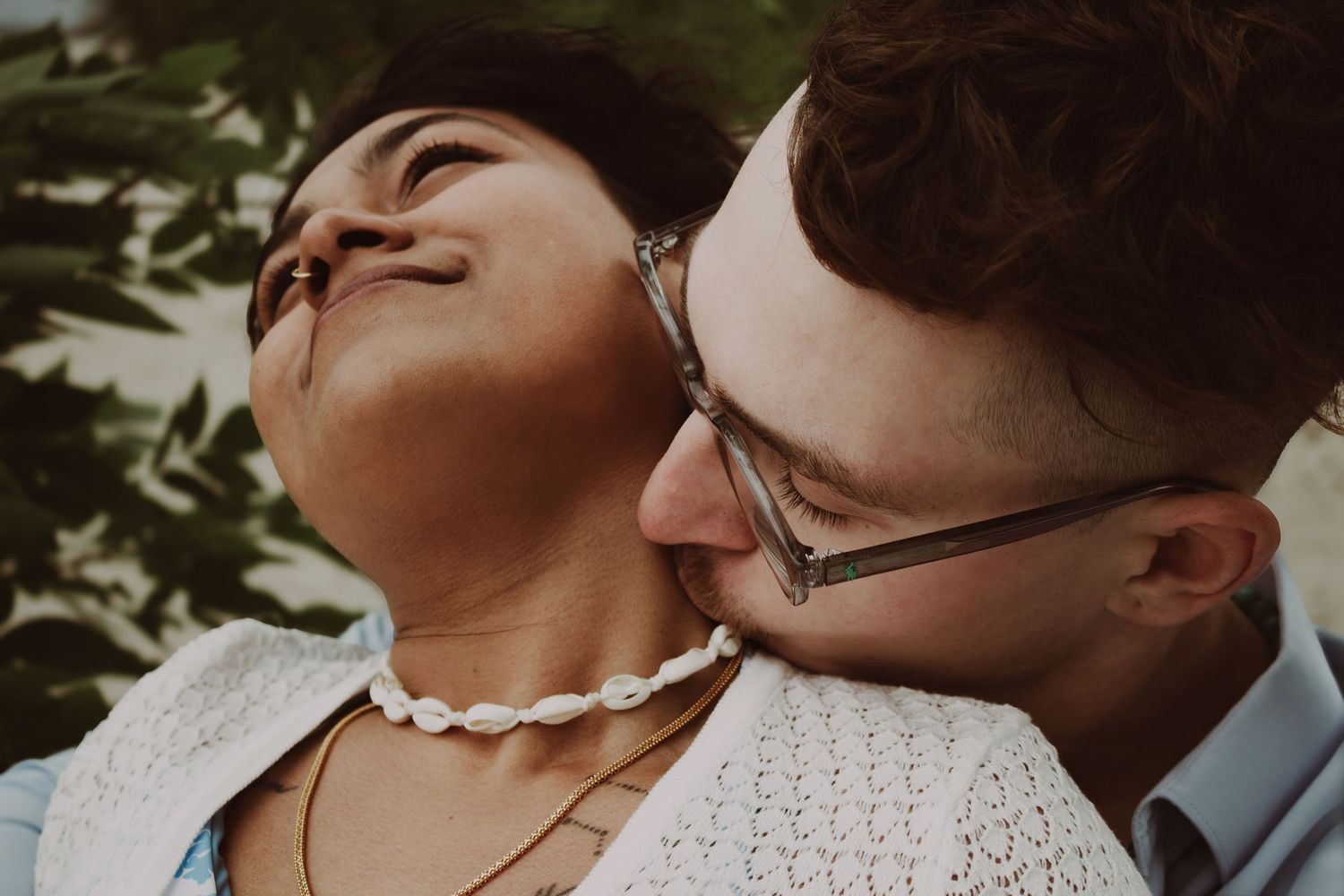 young couple posing at the beach