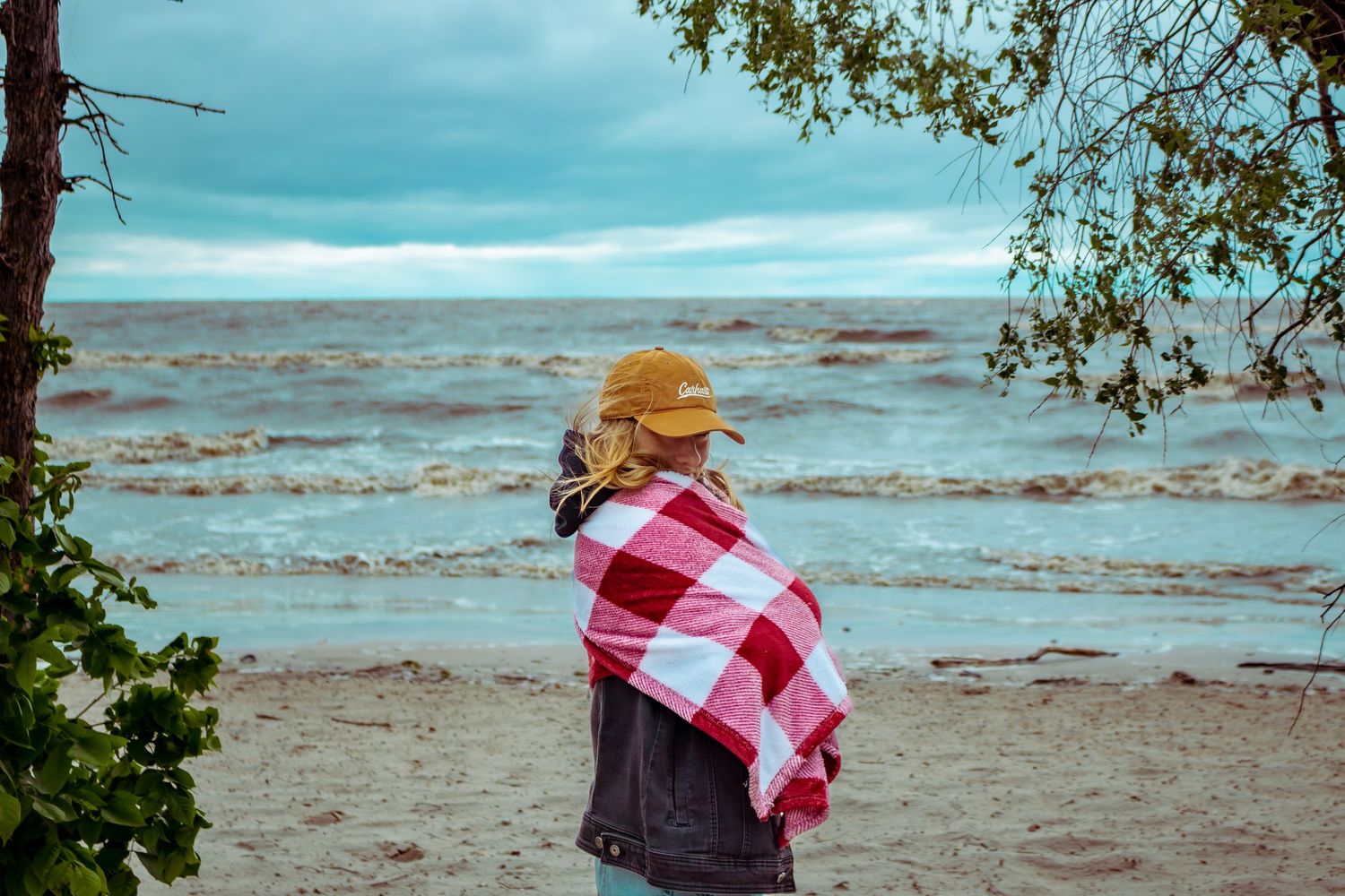 young woman posing at the beach