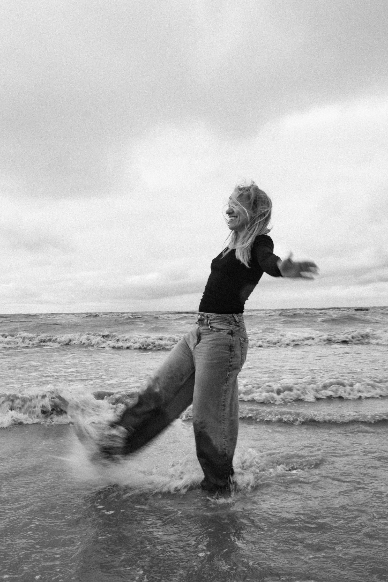 young woman posing at the beach