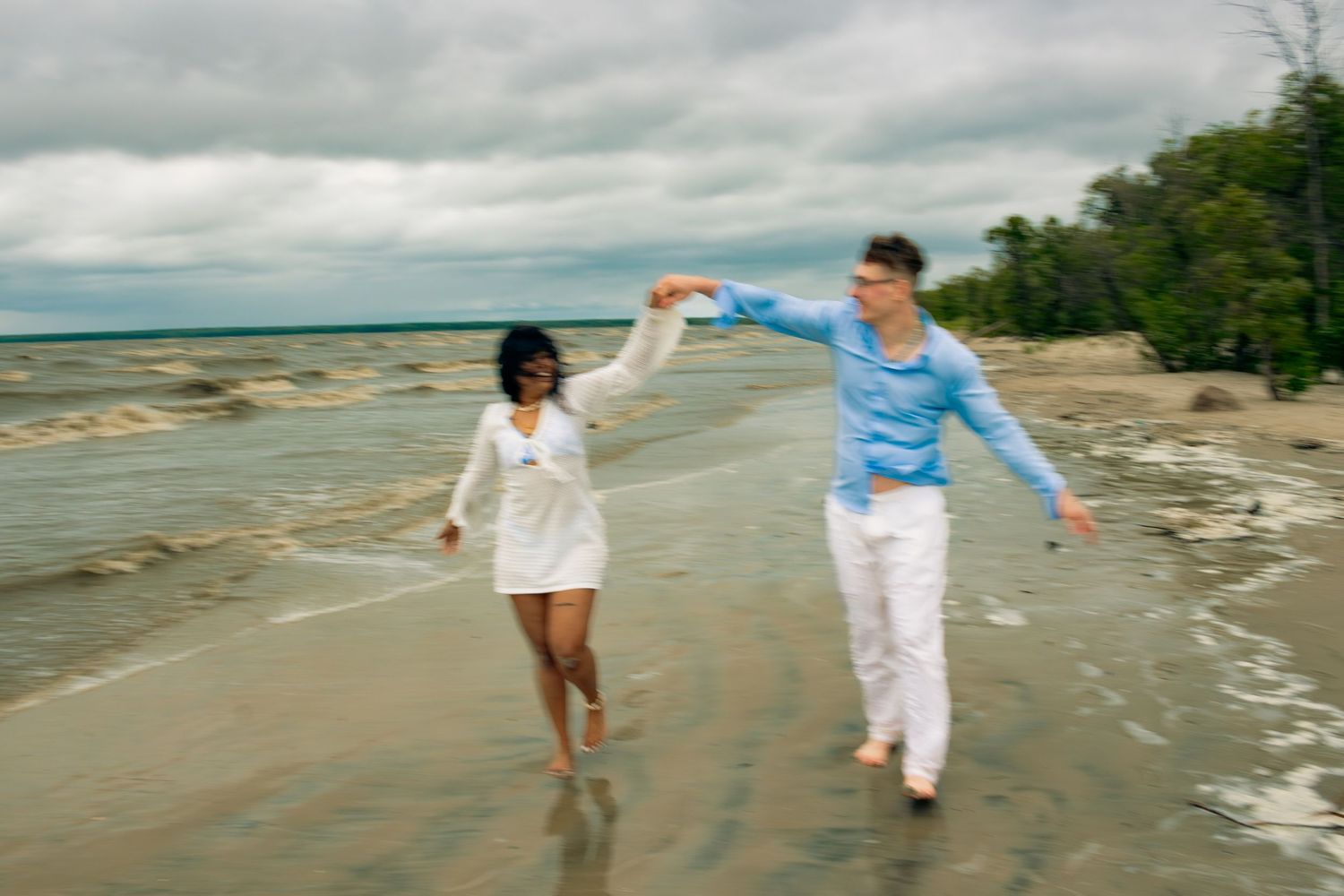 young couple posing at the beach