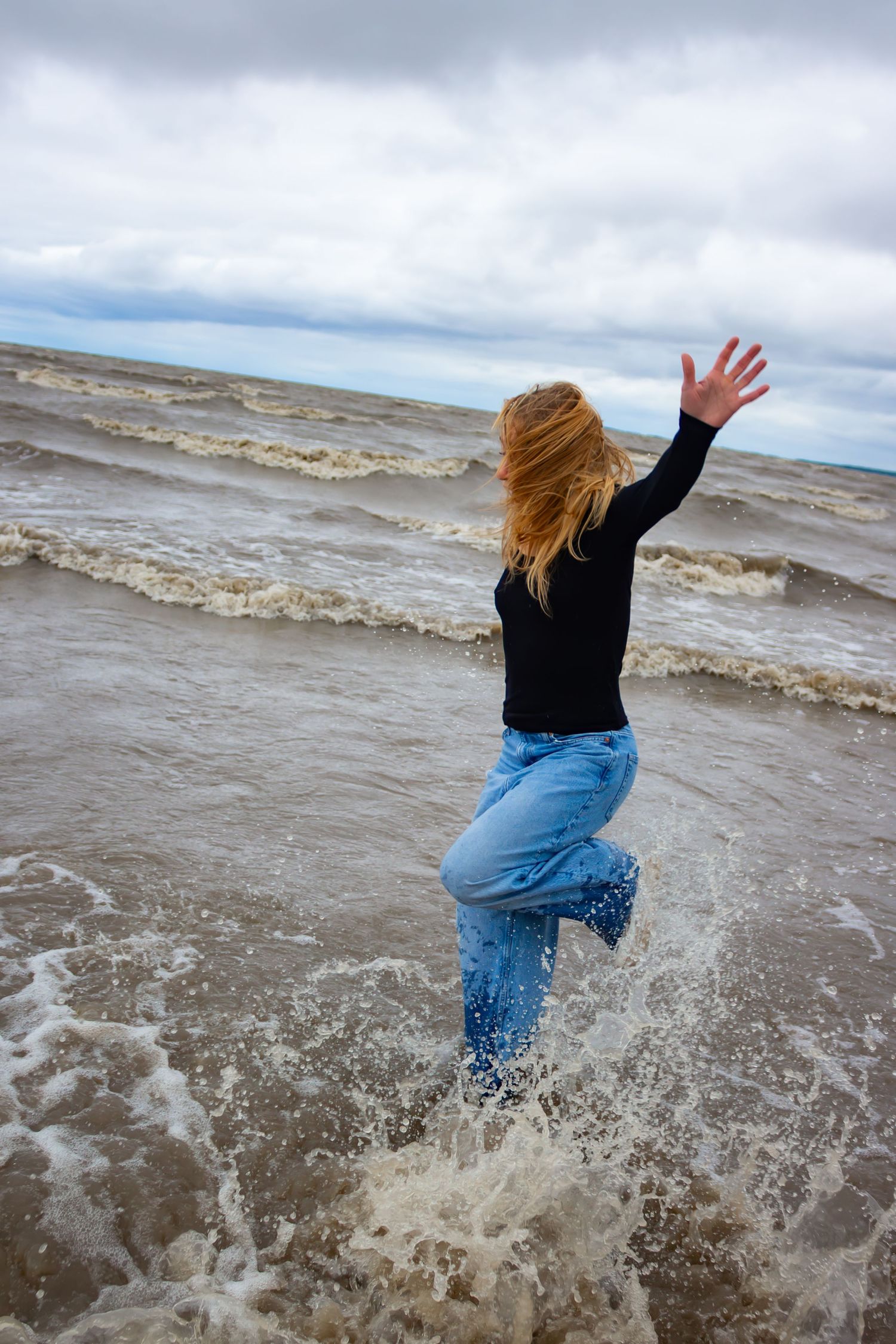 young woman posing at the beach