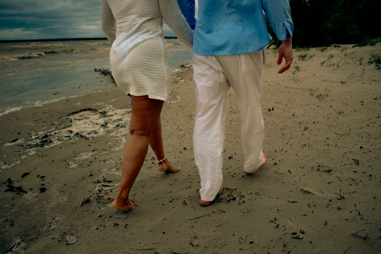 young couple posing at the beach