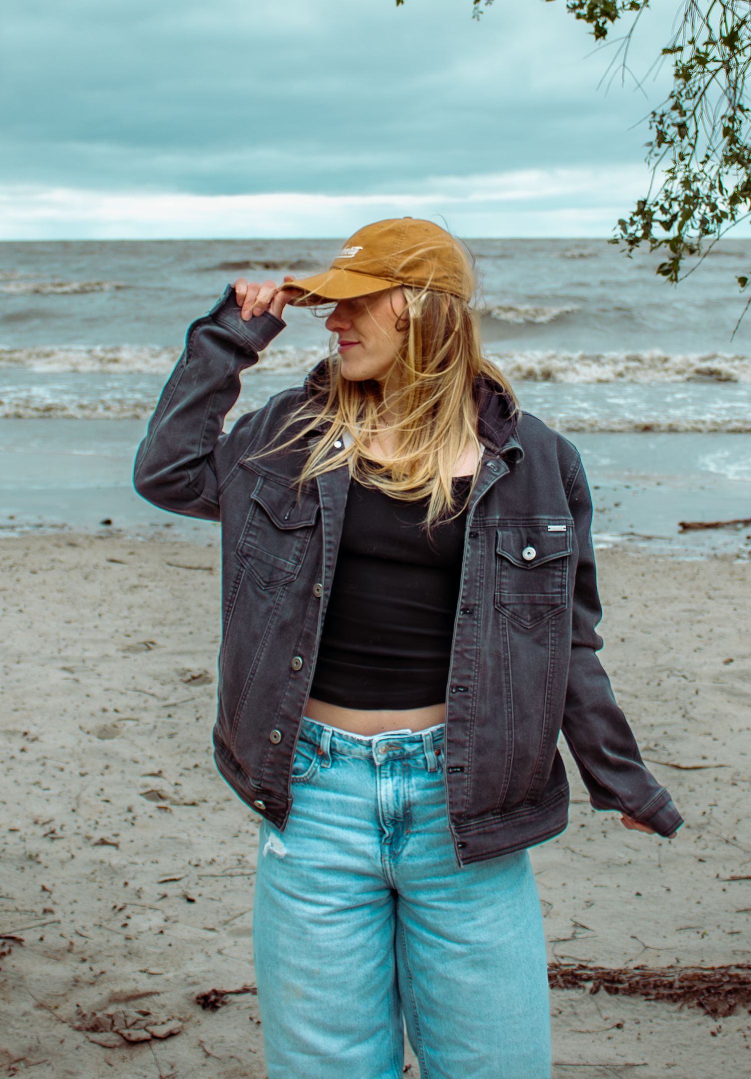 young woman posing at the beach