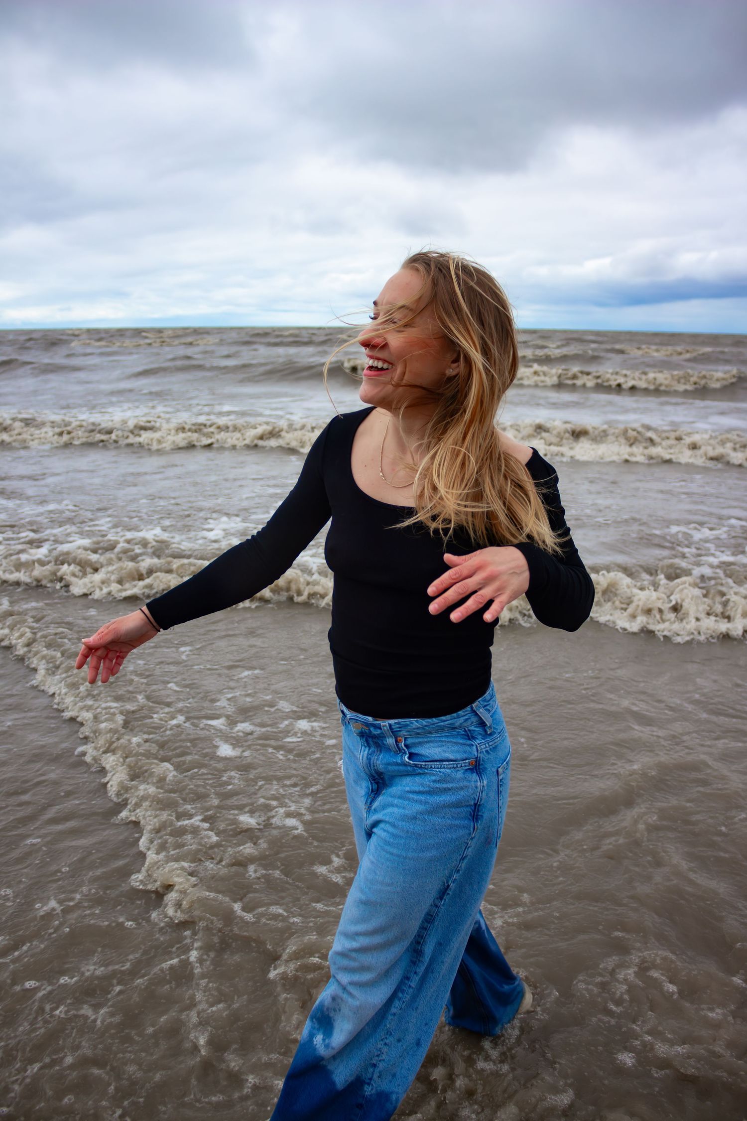 young woman posing at the beach