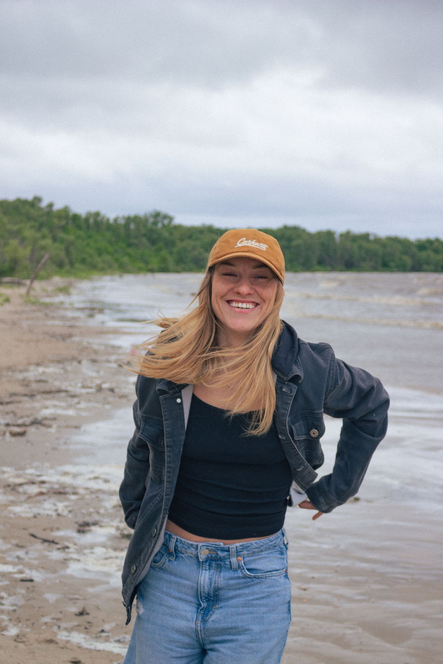 young woman posing at the beach