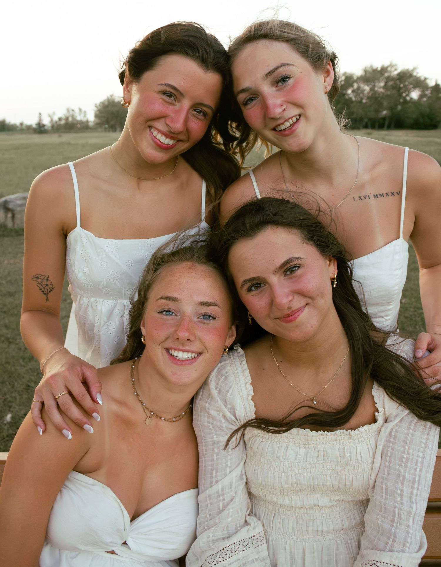 four young women posing for a portrait