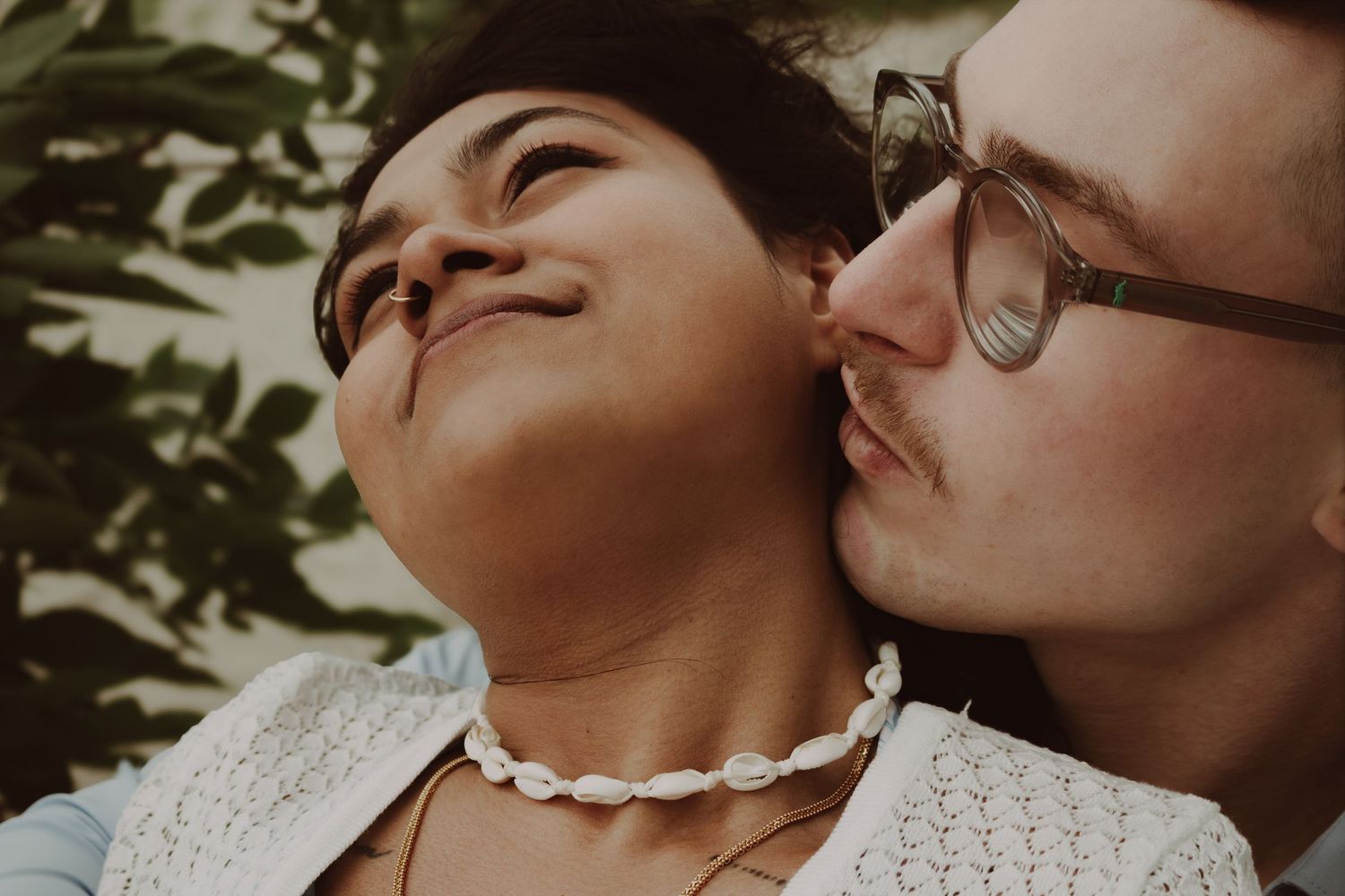 young couple posing at the beach