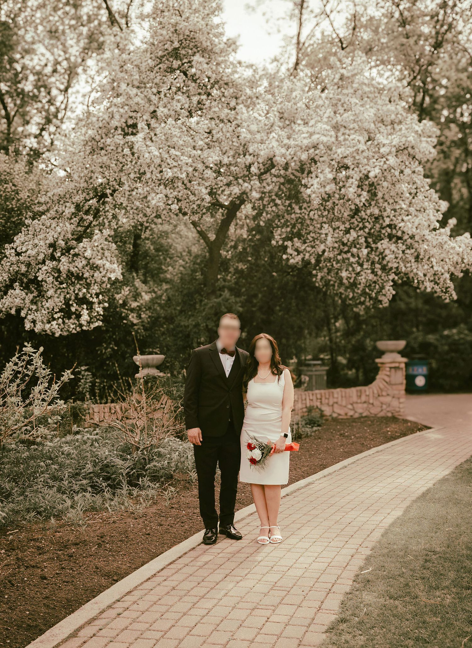couple posing in a garden