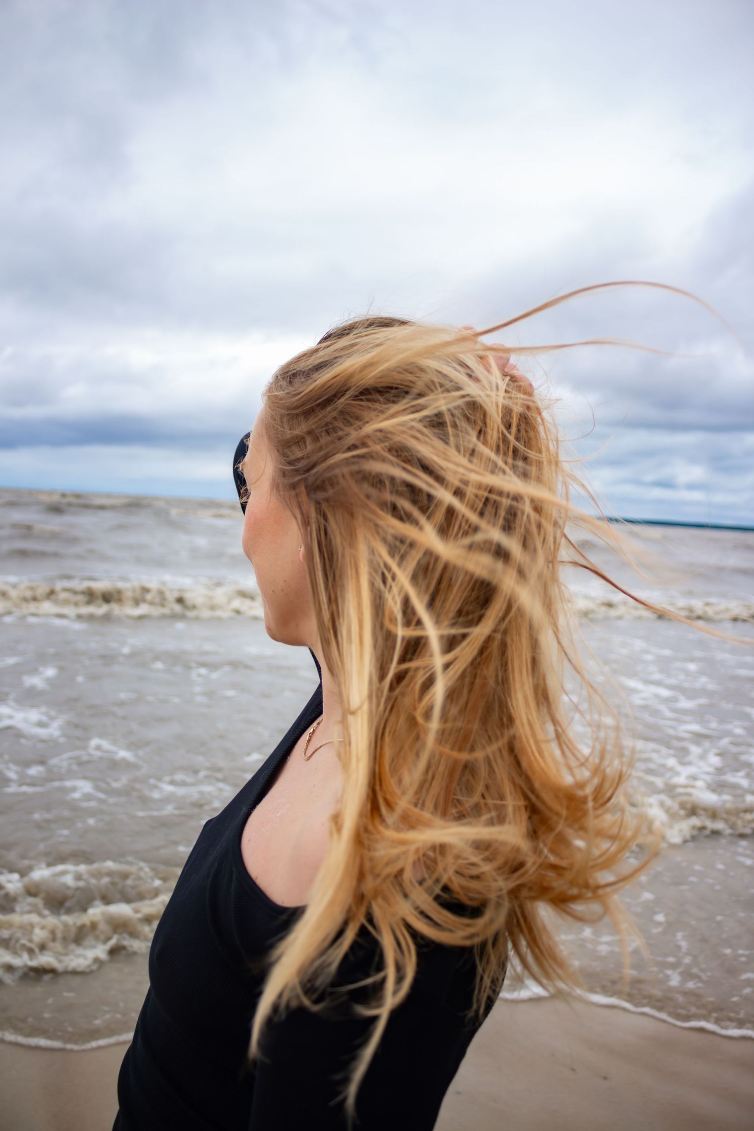 Young woman posing at the beach