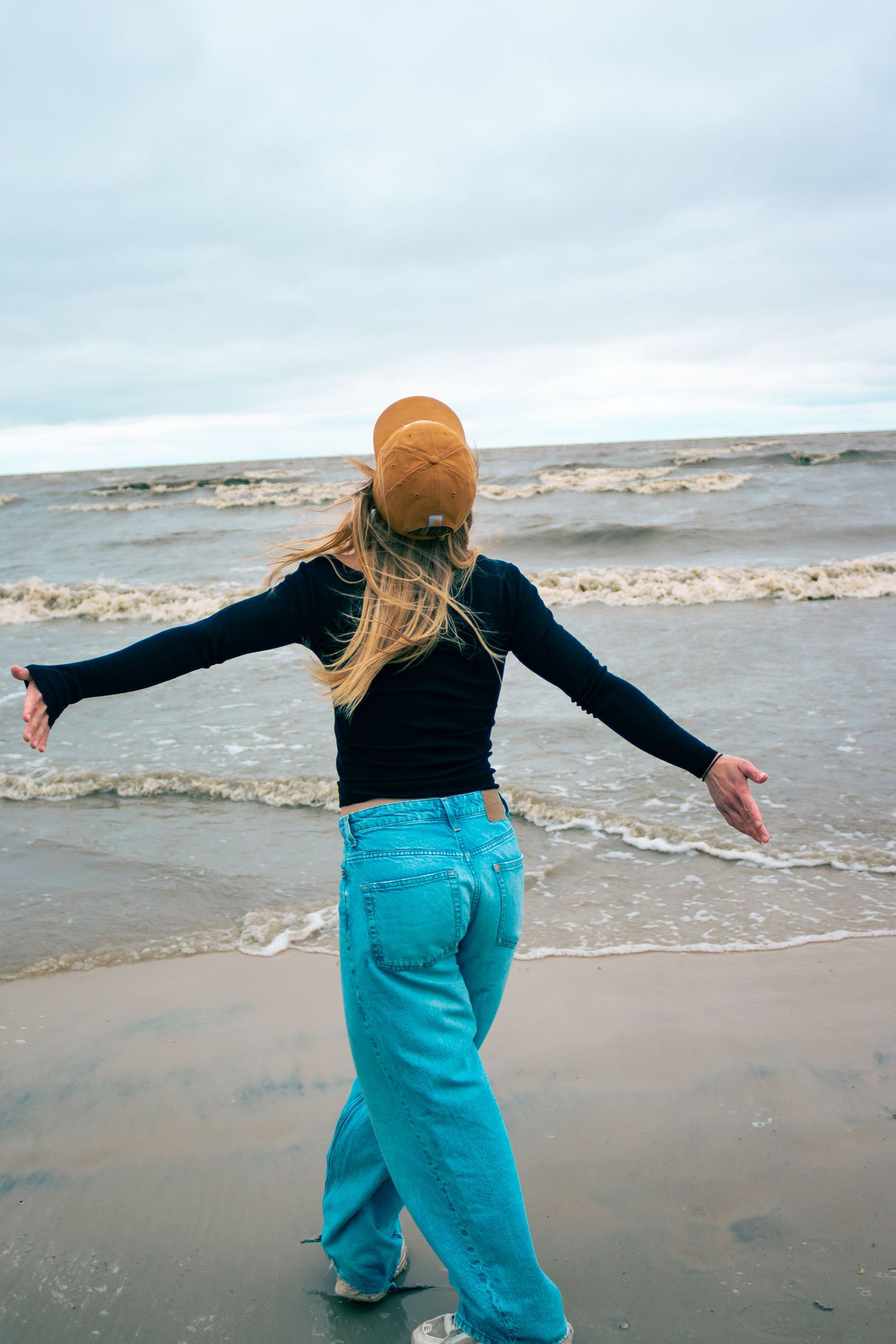 young woman posing at the beach