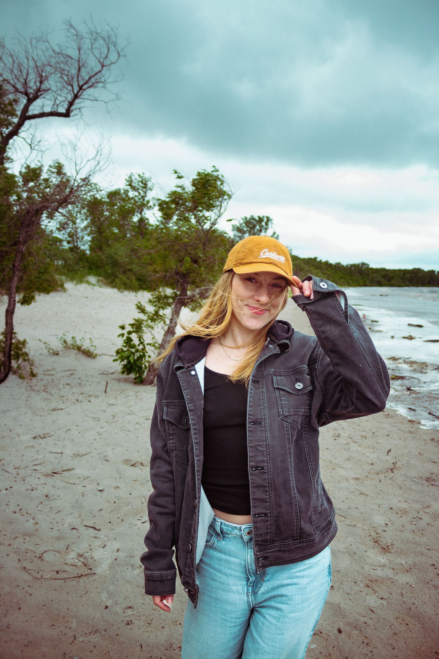 young woman posing at the beach