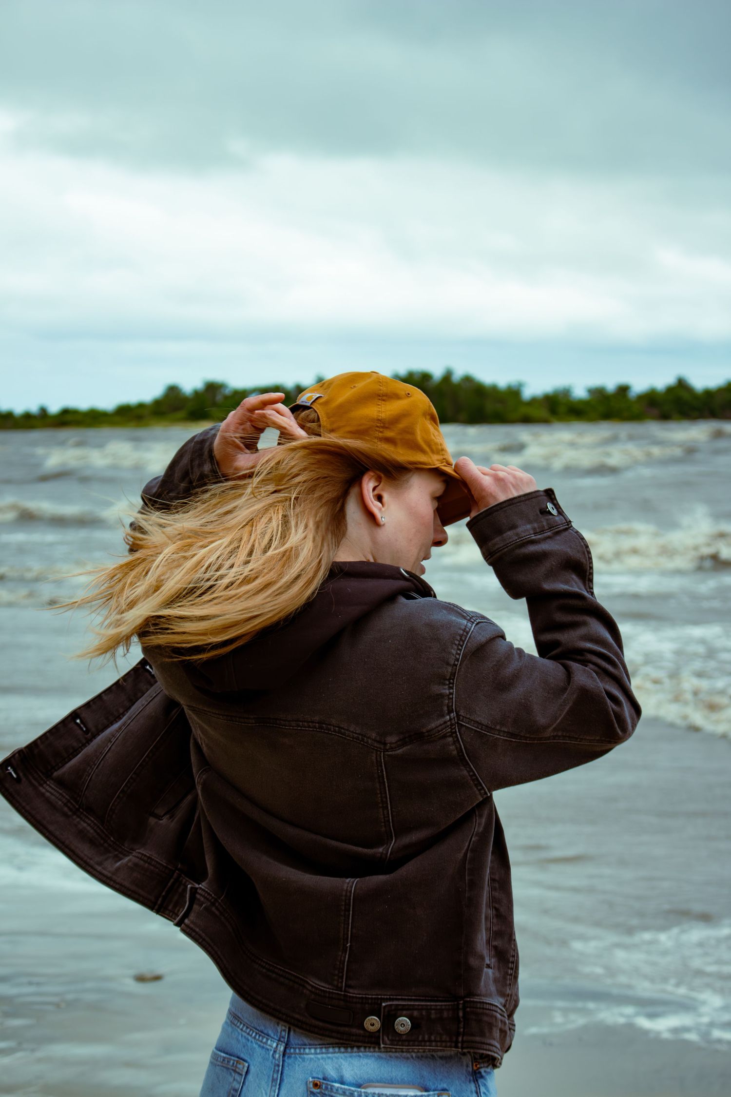 young woman posing at the beach
