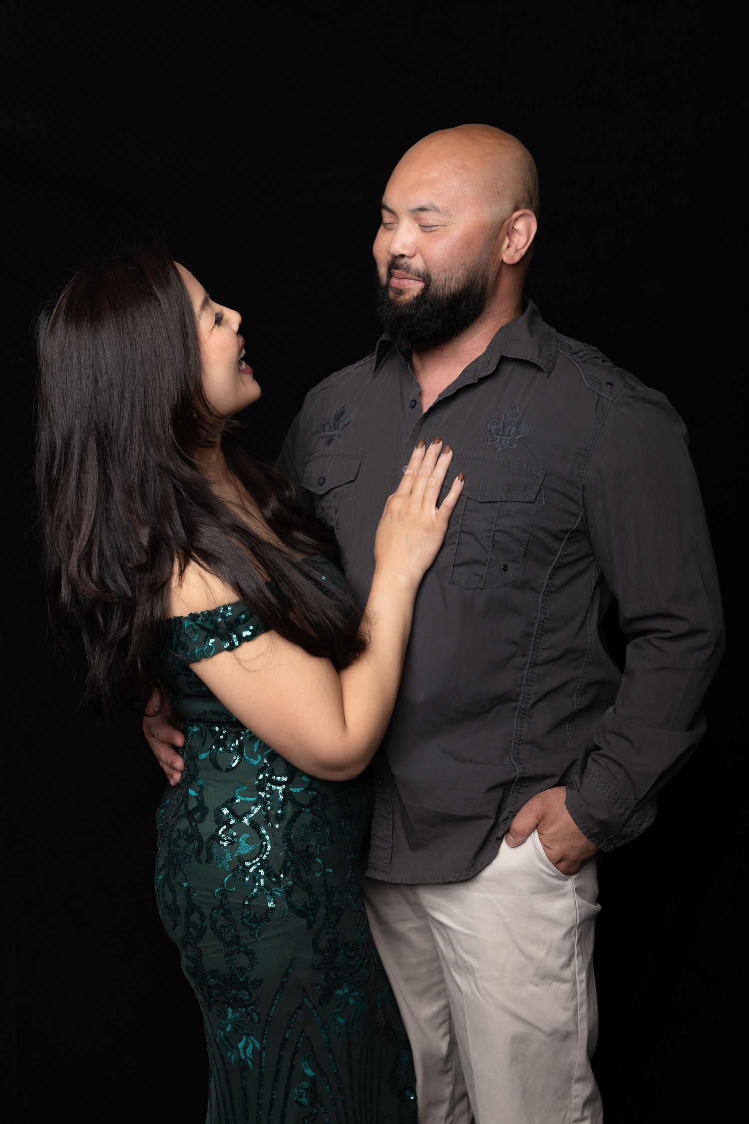 A couple embracing each other in their arms.