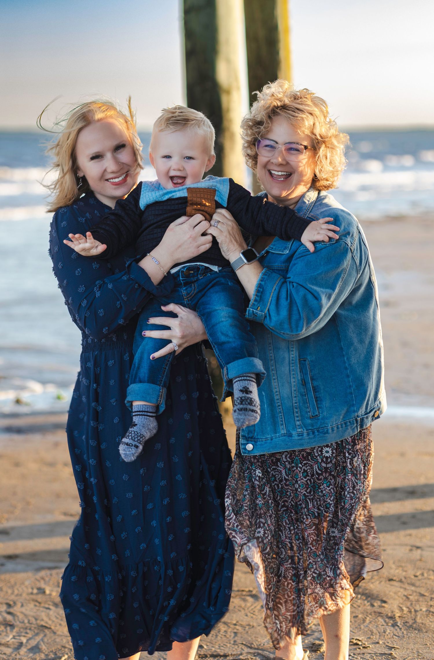 Family with baby under the pier