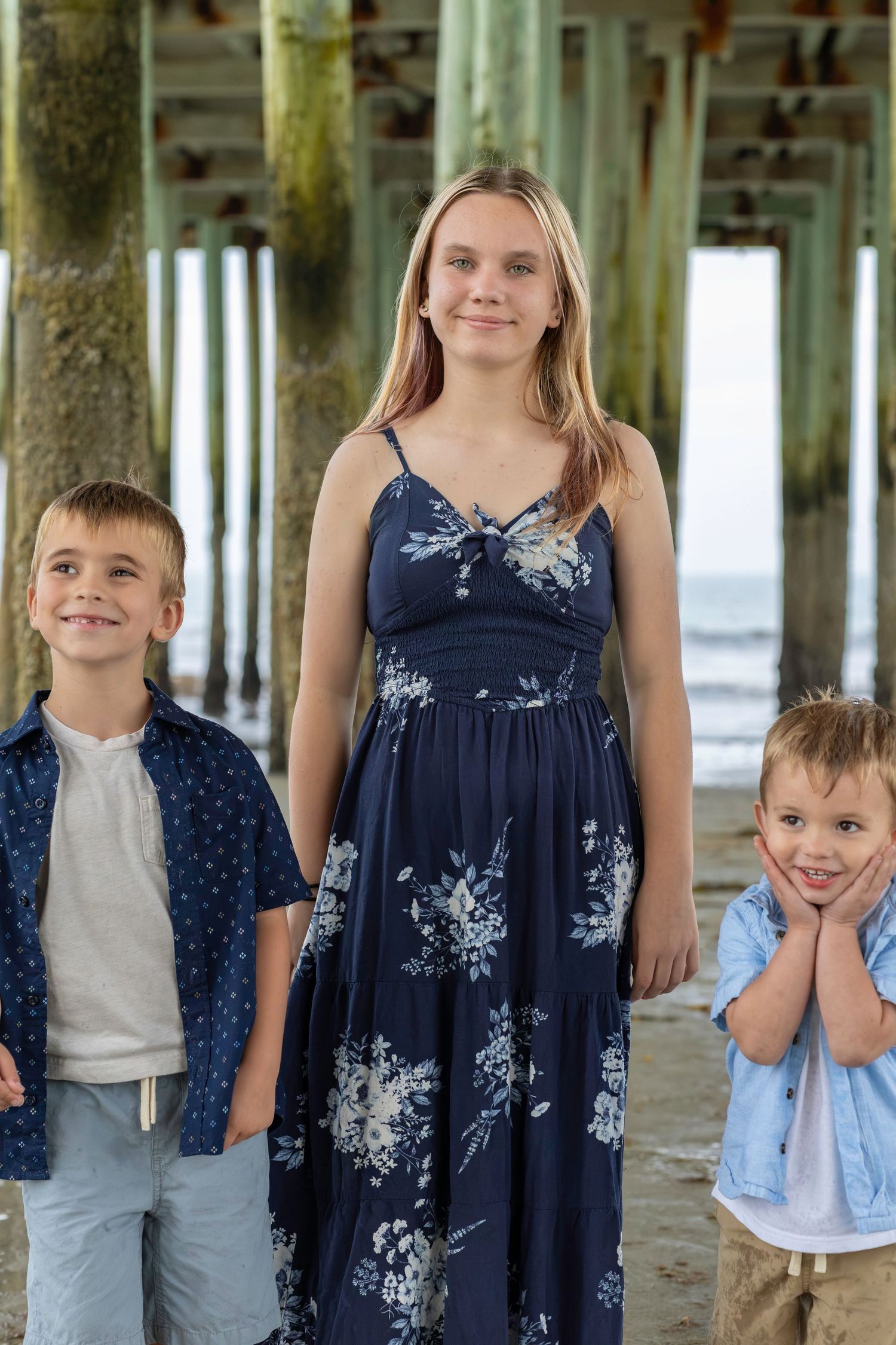 Family photo under the old orchard beach pier
